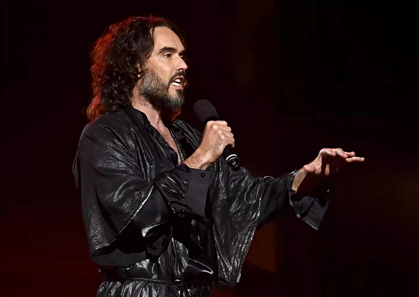 Russell Brand began his career as a comedian.