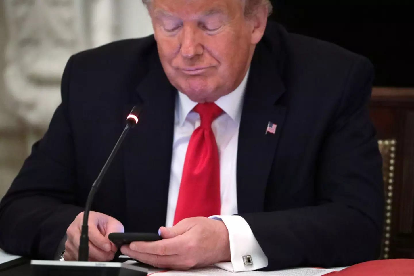 Why does US president, Donald Trump, keep signing off his social media posts with his full name and title? (Alex Wong / Staff / Getty Images)