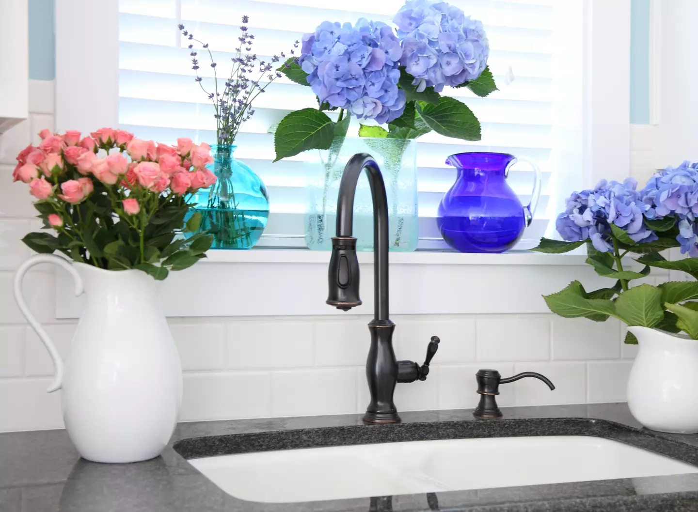 Have you ever wondered why kitchen sinks always seem to be underneath a window? (