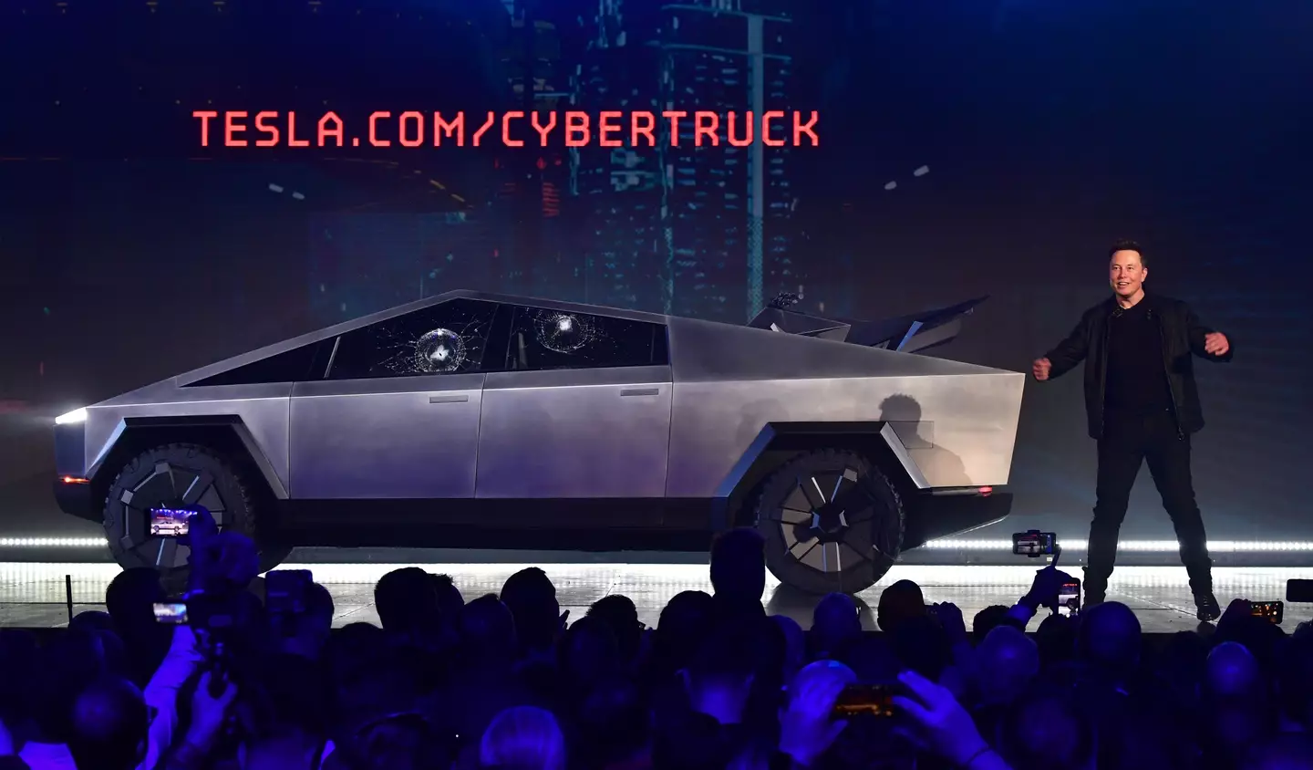 Elon Musk with a Cybertruck.