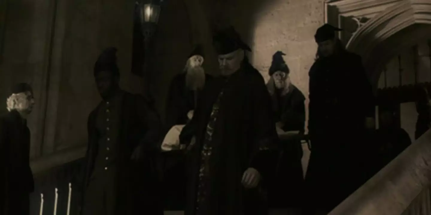 Alfred Burke (wearing a pointed hat in the background).