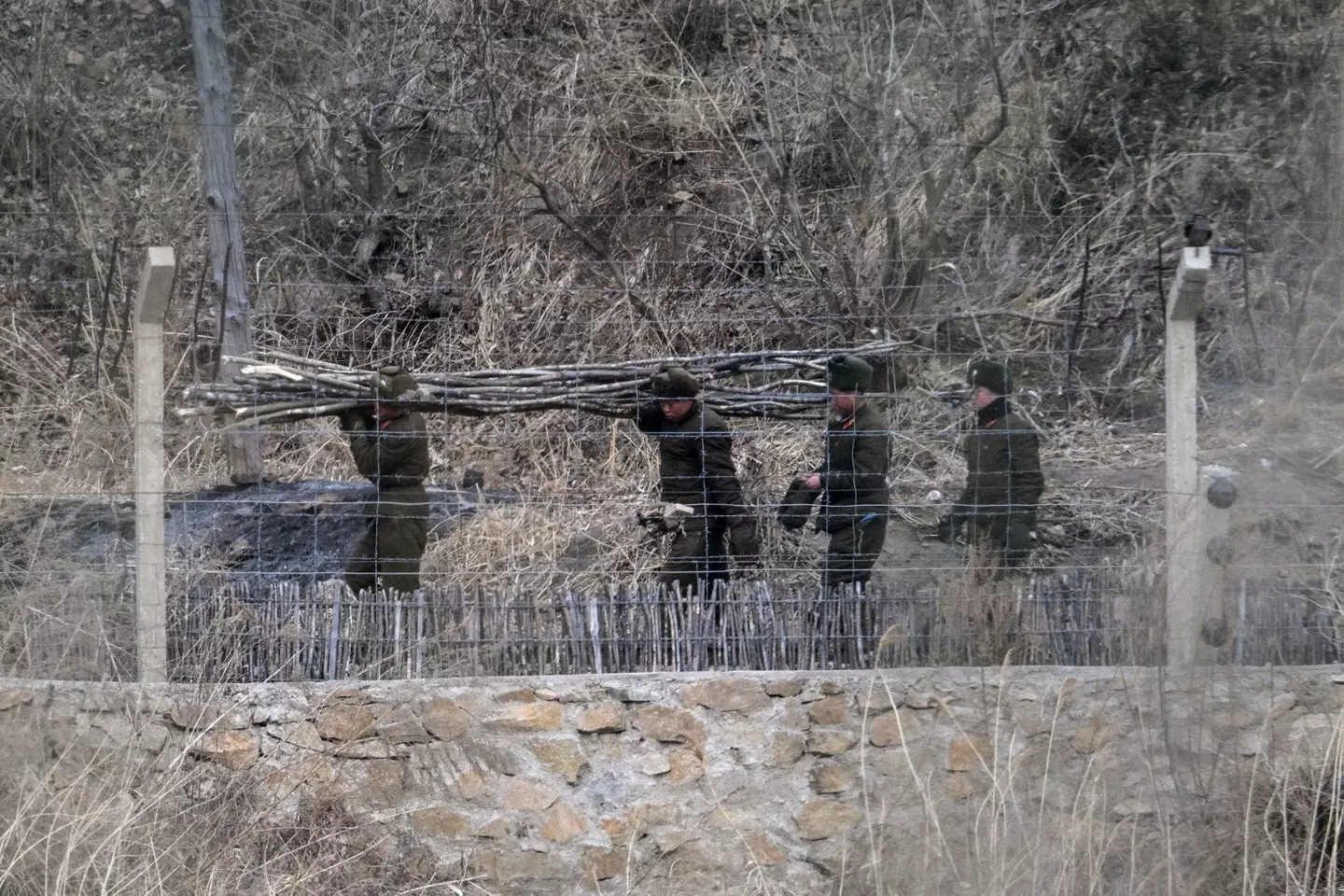 Soliders photographer working on the border - as seen from Tumen in China's northeast Jilin province.