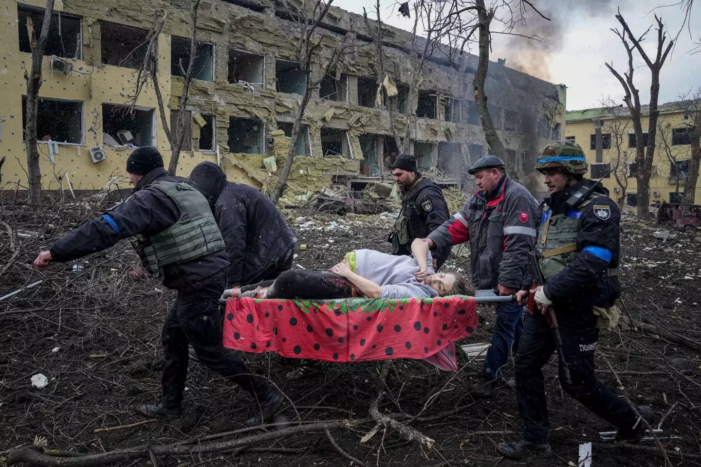 The woman was pictured being rescued from the rubble (Evgeniy Maloletka/AP/Shutterstock)