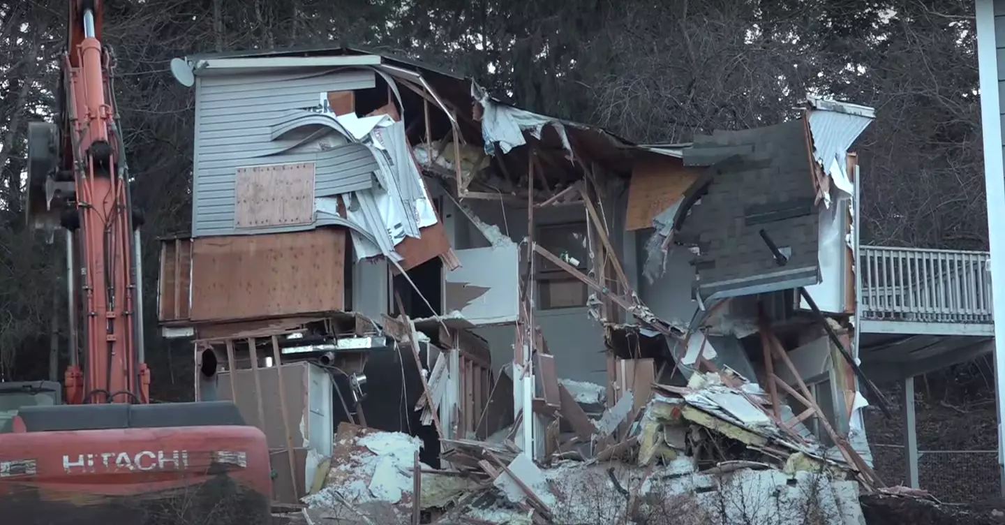 Despite protests from some of the victim's families, the house was torn down earlier today (December 28).