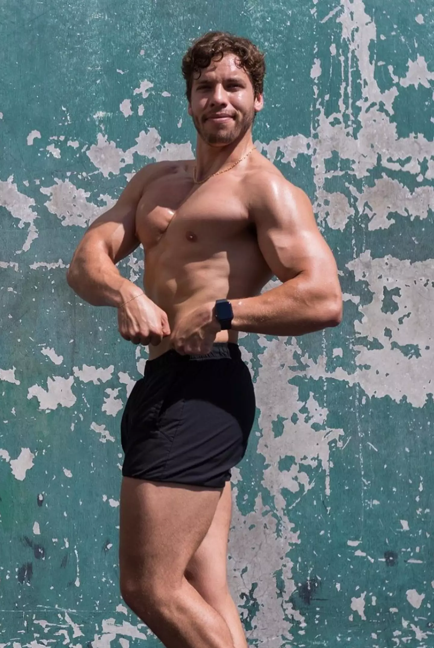 Arnold Schwarzenneger's son, Joseph Baena, flexing his gains.