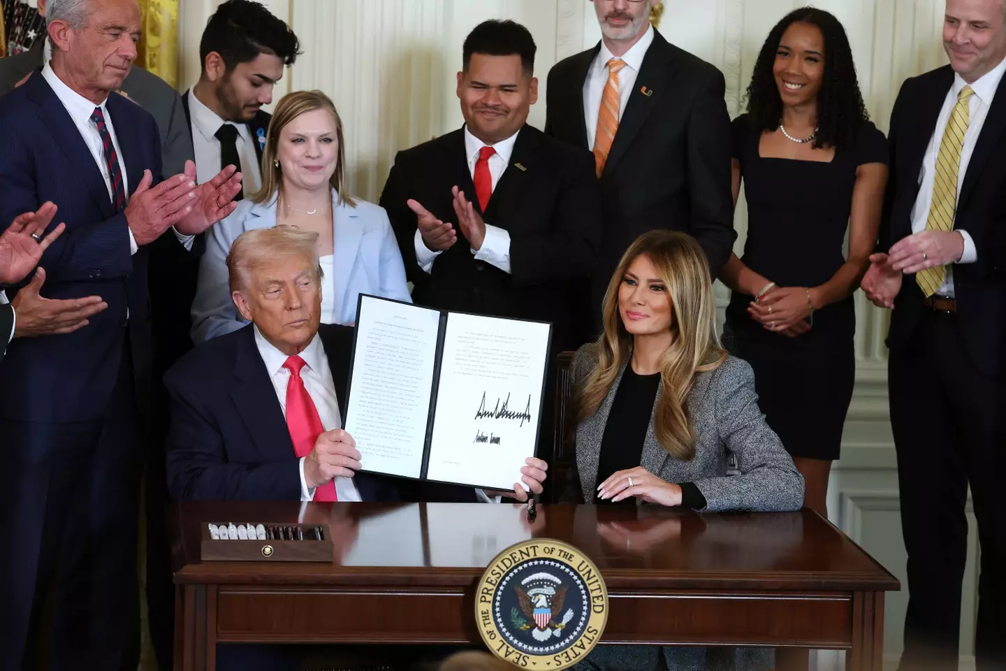 Melania signed the executive order alongside her husband (Anna Moneymaker/Getty Images)
