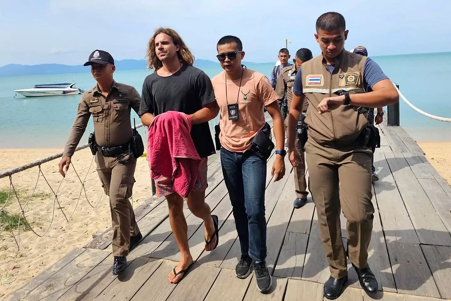 Daniel Sancho Bronchalo being escorted by police in August 2023 (STR/DAILYNEWS/AFP via Getty Images)