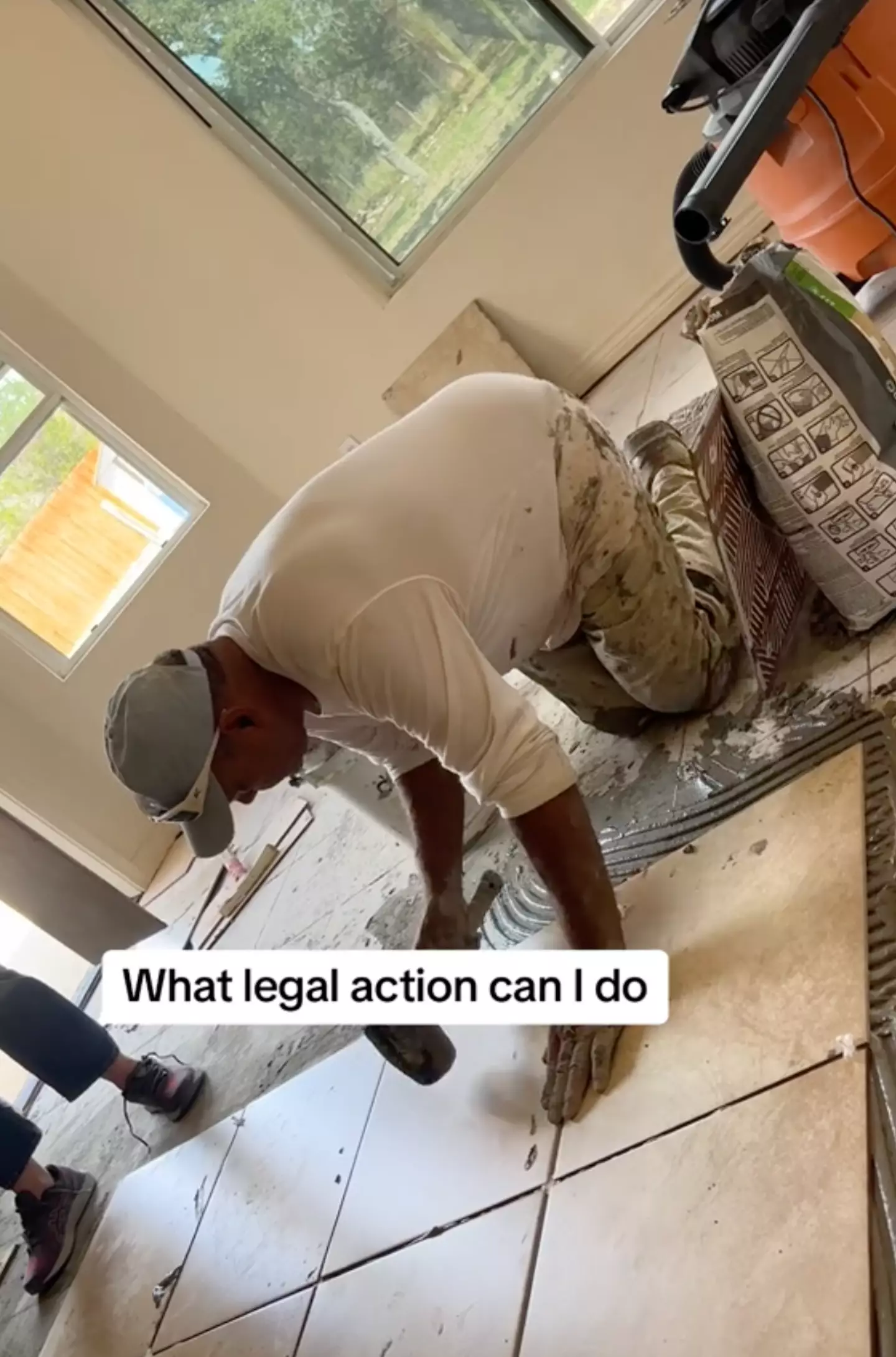 Alex even recorded the woman hoovering over his colleague.