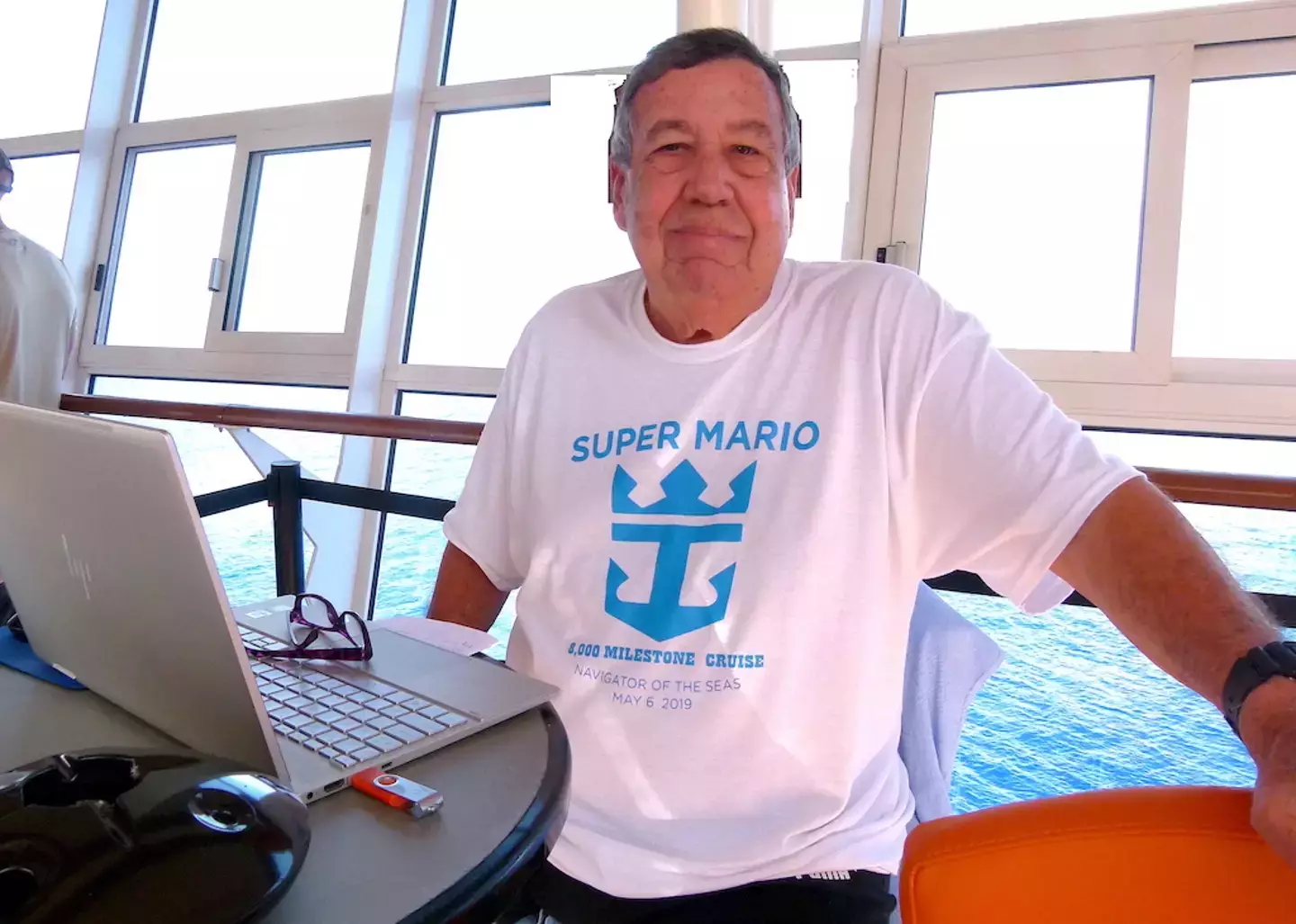 The face of a man happy to be living on a floating home sailing around the world (All Things Cruise)