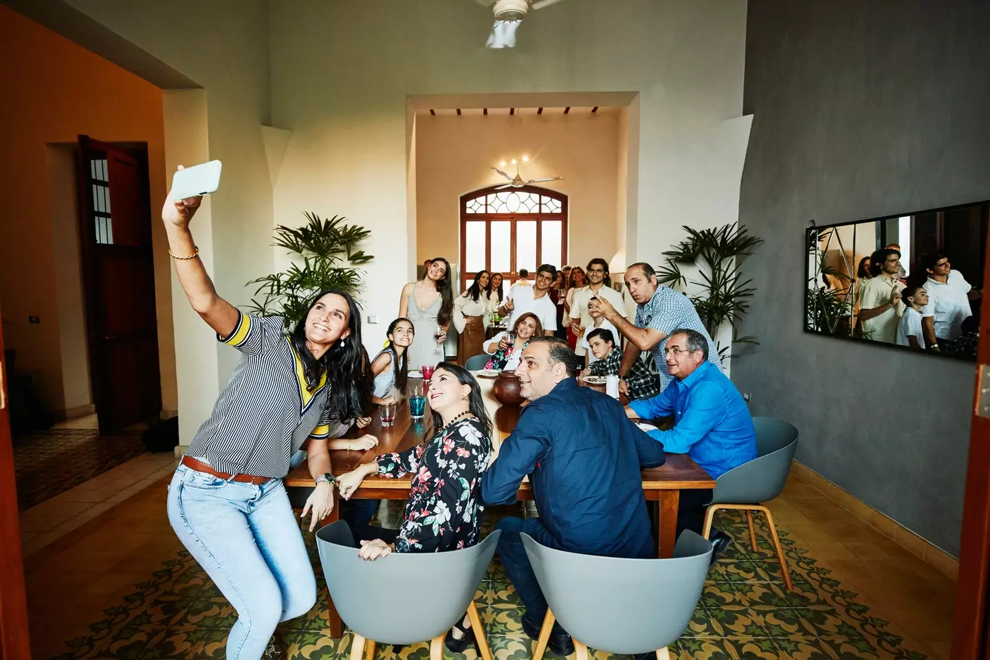Many teens might make the gesture while having their picture taken with family. (Thomas Barwick / Getty)