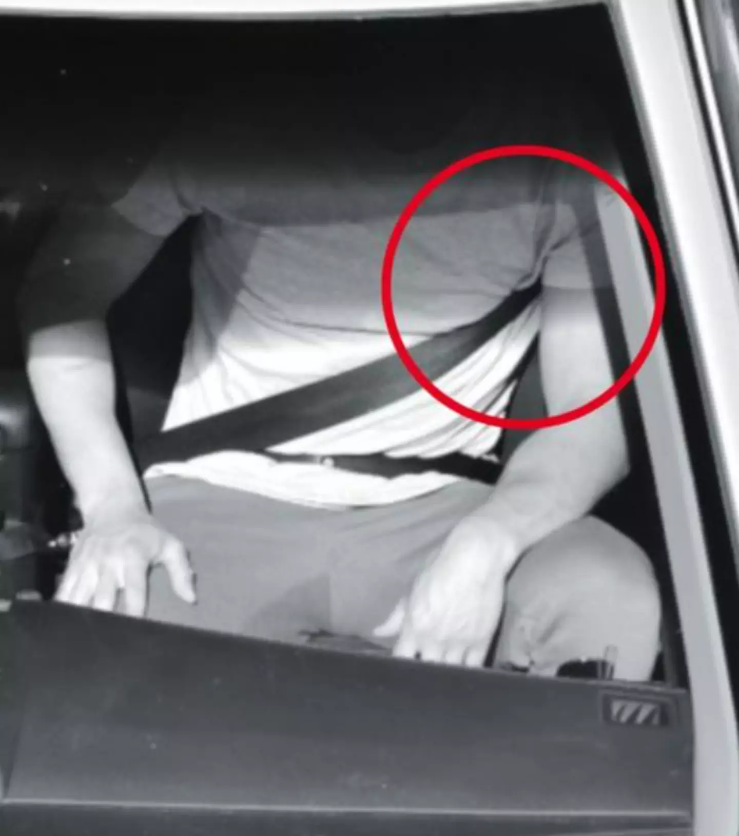 A example from Queensland Government of someone incorrectly wearing a seatbelt.
