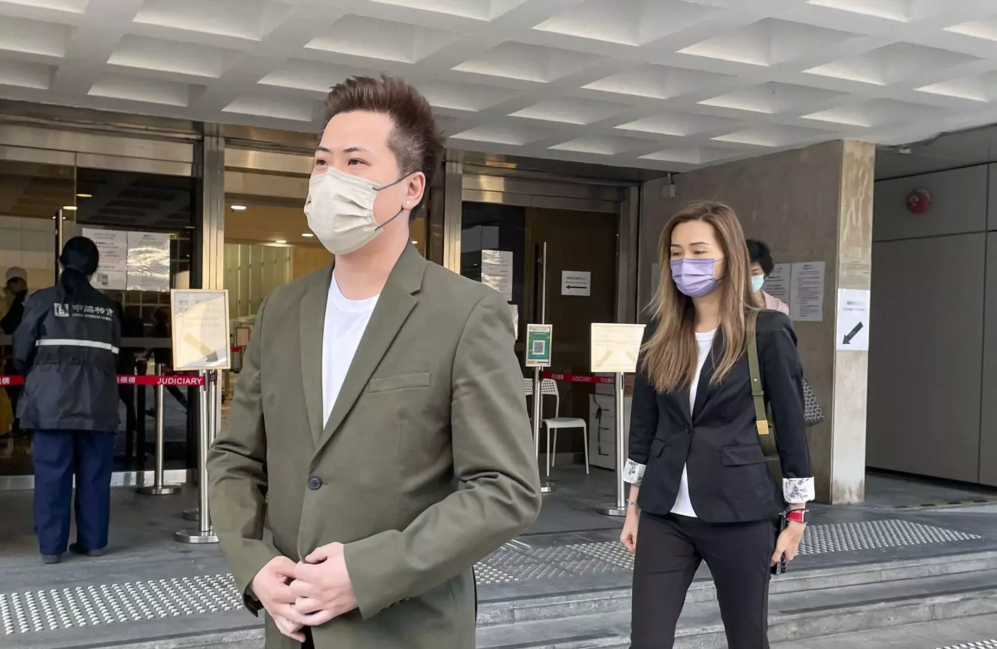 Louis Wan Ho-lun and his wife Leung Pik-kei leaving court after testifying against Joe Chen in 2021.