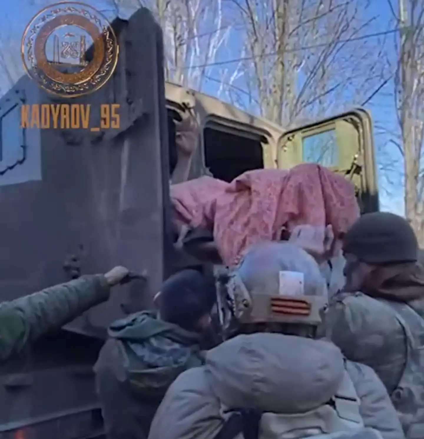 Yuri Medvedev being transported by Chechen troops.