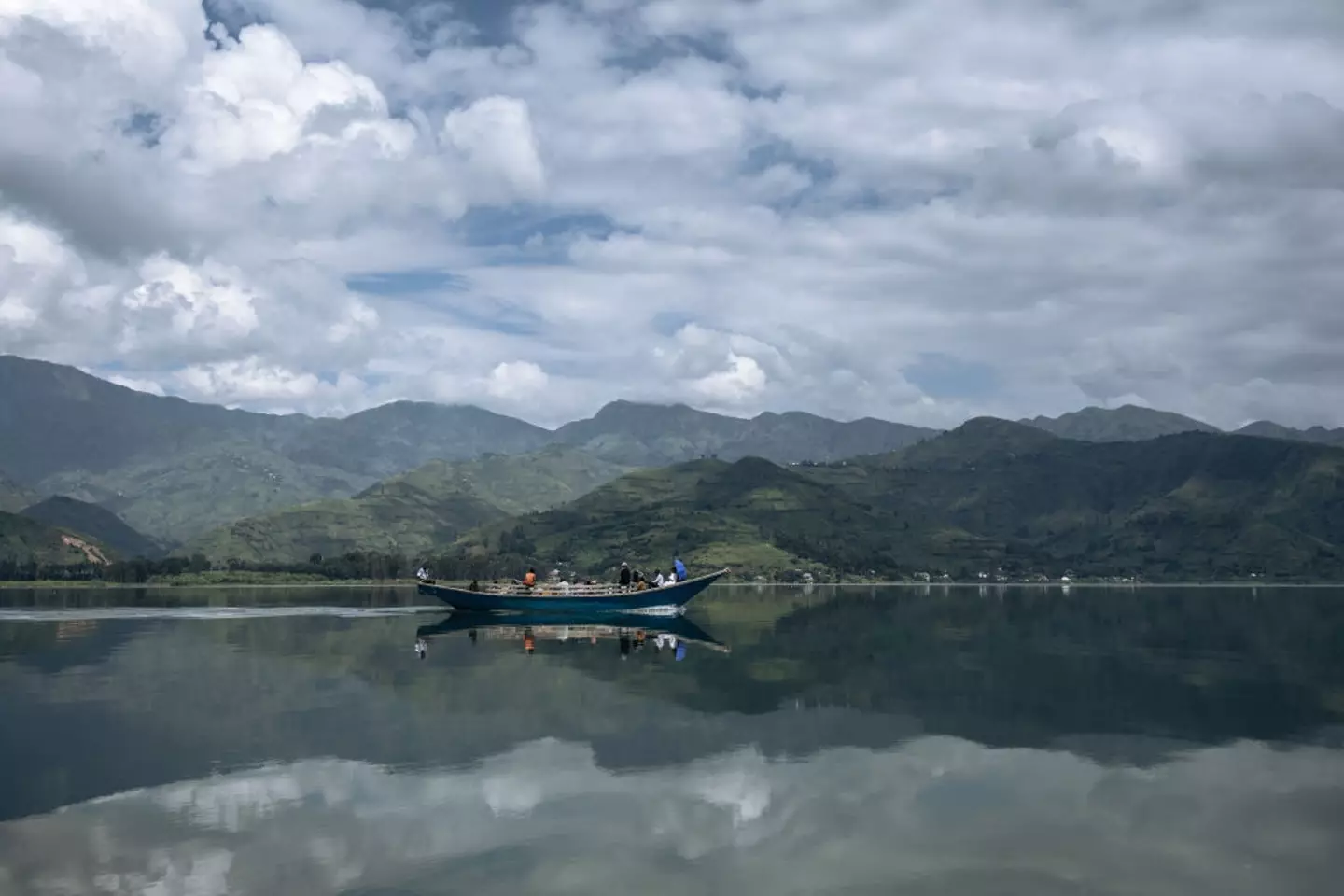 Passengers sail on a handmade wooden boat on Lake Kivu from Minova to Goma, back in March (ALEXIS HUGUET/AFP via Getty Images)