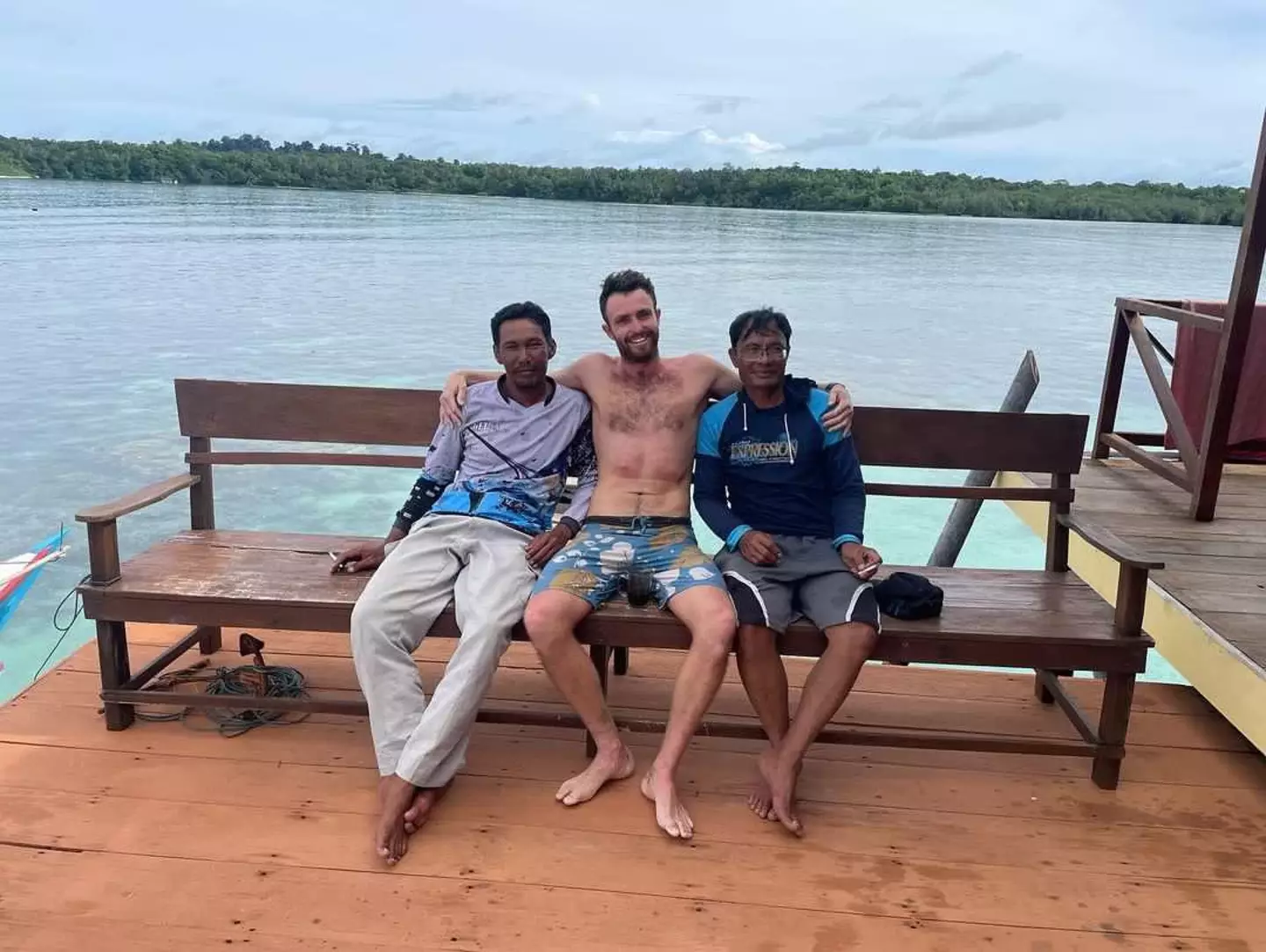 Elliot Foote pictured with the two fishermen who pulled him out of the water - ending his 37-hour nightmare (Courtesy of Elliot Foote)
