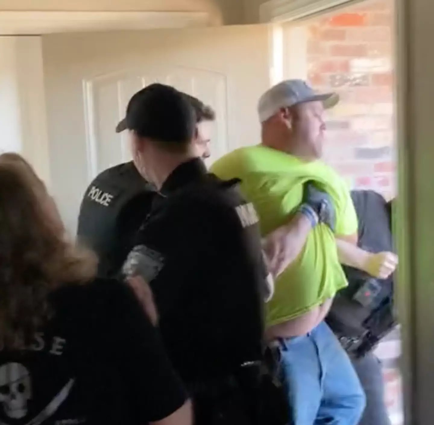 Police hauled Sherland out of the home.