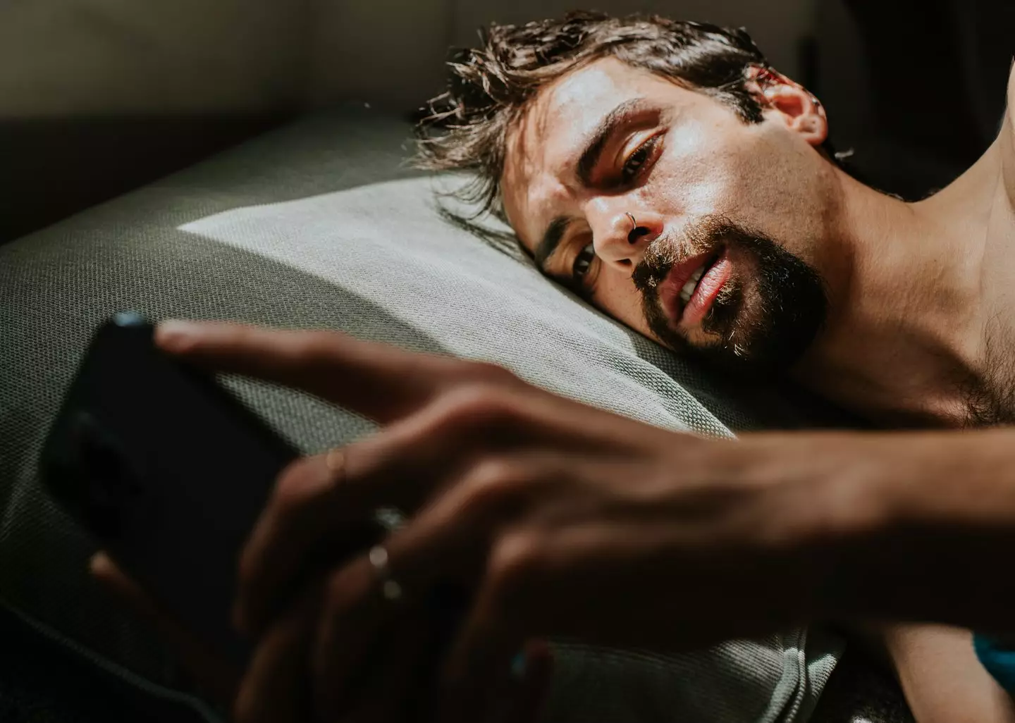 Scrolling into the night might leave your desire buffering (Catherine Falls Commercial/Getty Images)