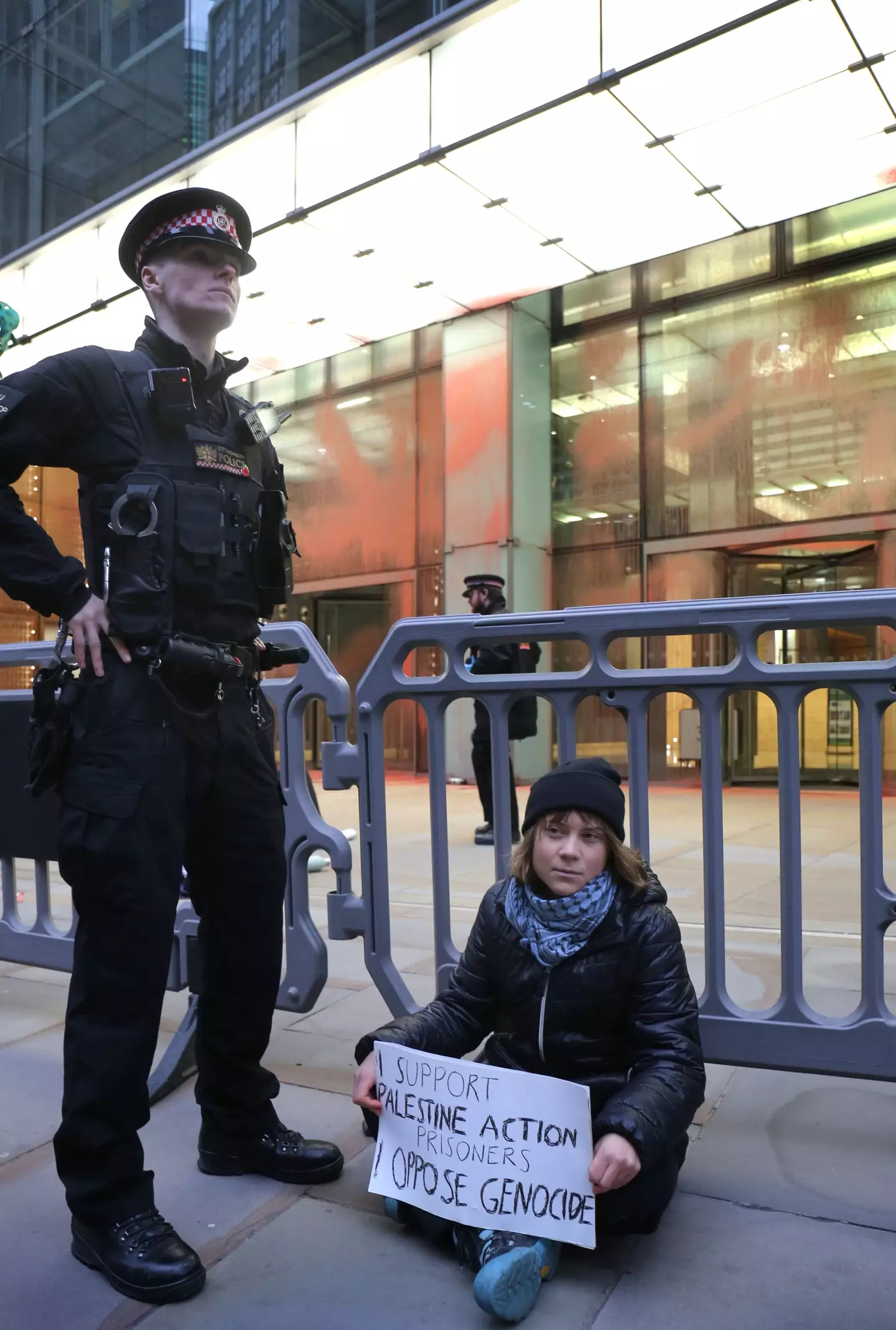 Greta Thunberg grips a placard that read: "I support the Palestine Action prisoners. I oppose genocide." (PA/Prisoners for Palestine)