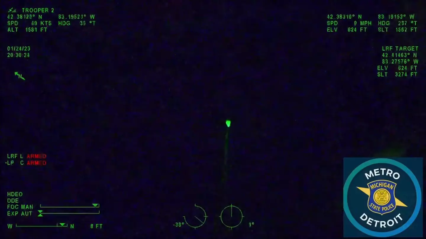 The man started with aiming a green laser at the helicopter.