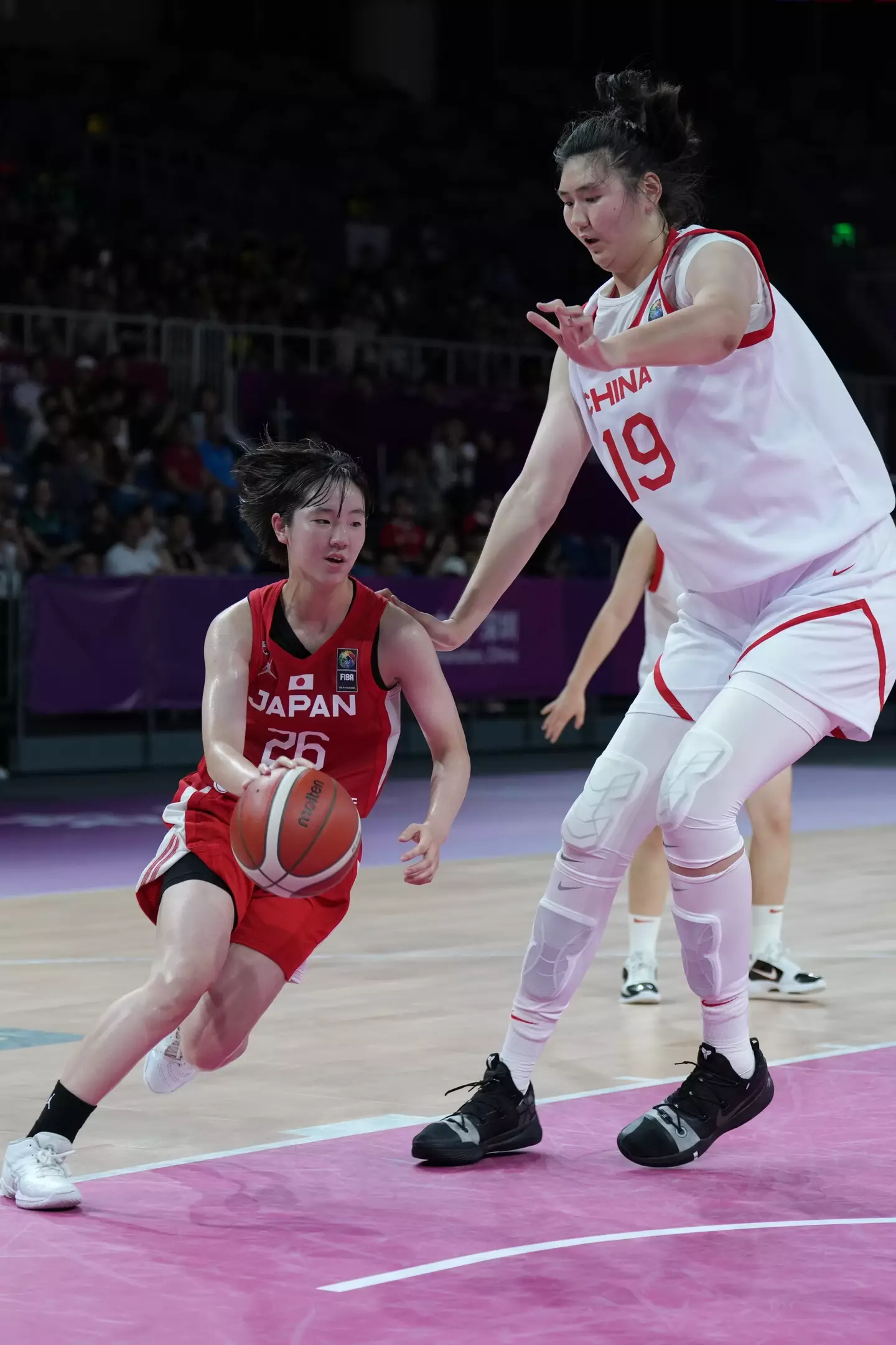 The basketball star is over seven foot. (Fred Lee/Getty Images)