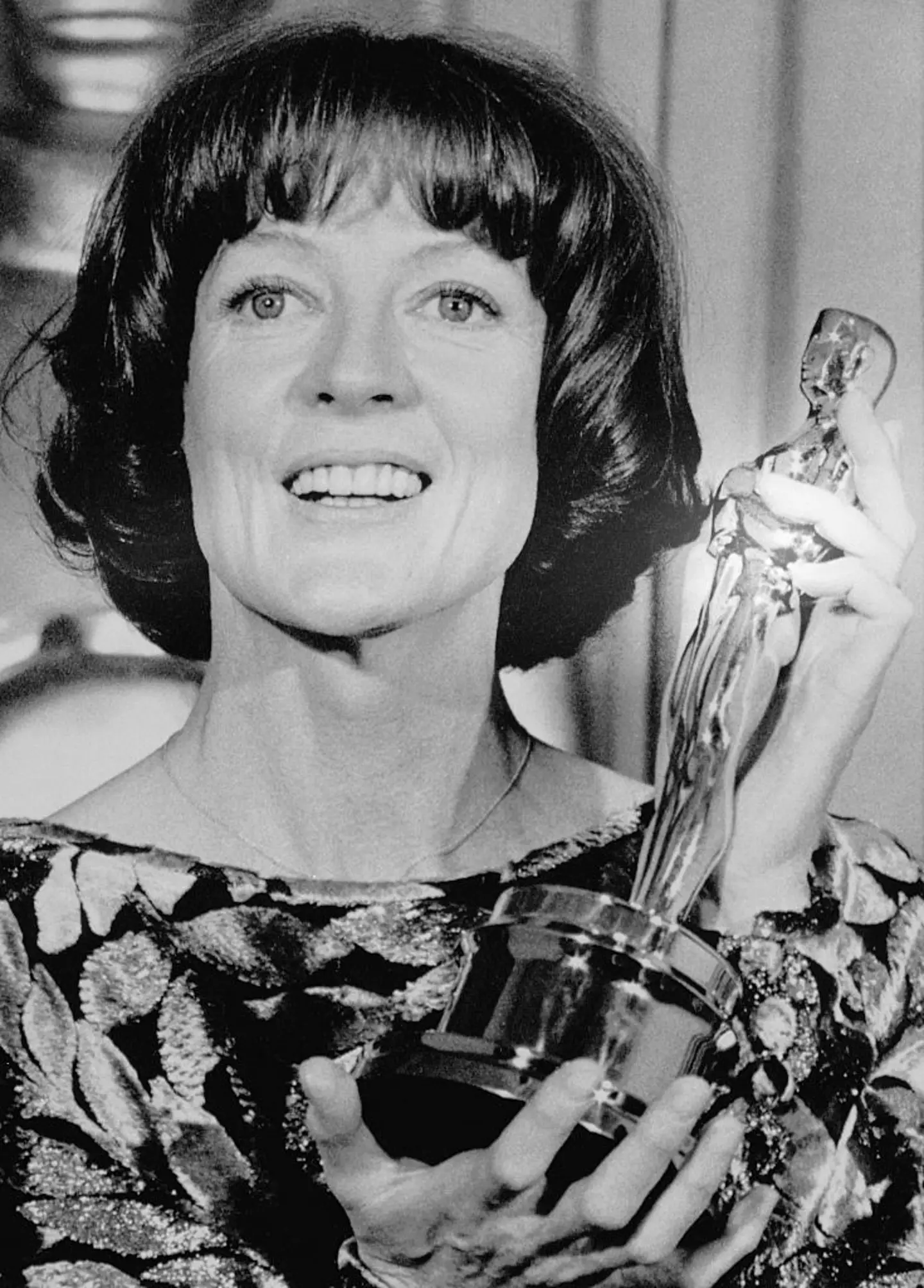 Smith with her second Oscar for the Best Supporting Actress which she picked up in 1979 for her role in California Suite (Getty/Bettmann)