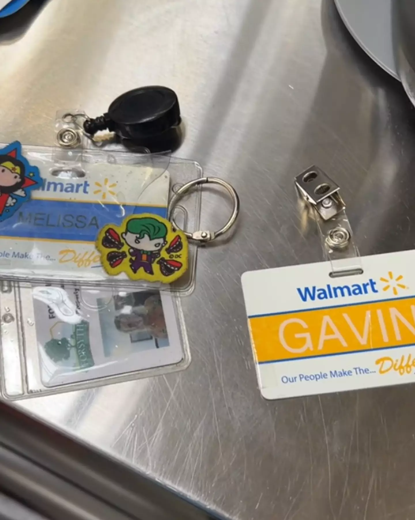 One badge has a yellow strip of color and the other blue. (TikTok/@candy.cream4)