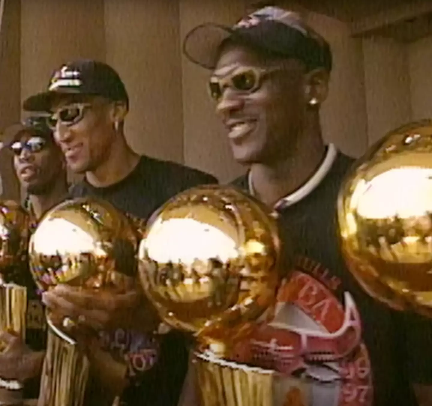 Michael Jordan (right) with Scottie Pippen (middle).