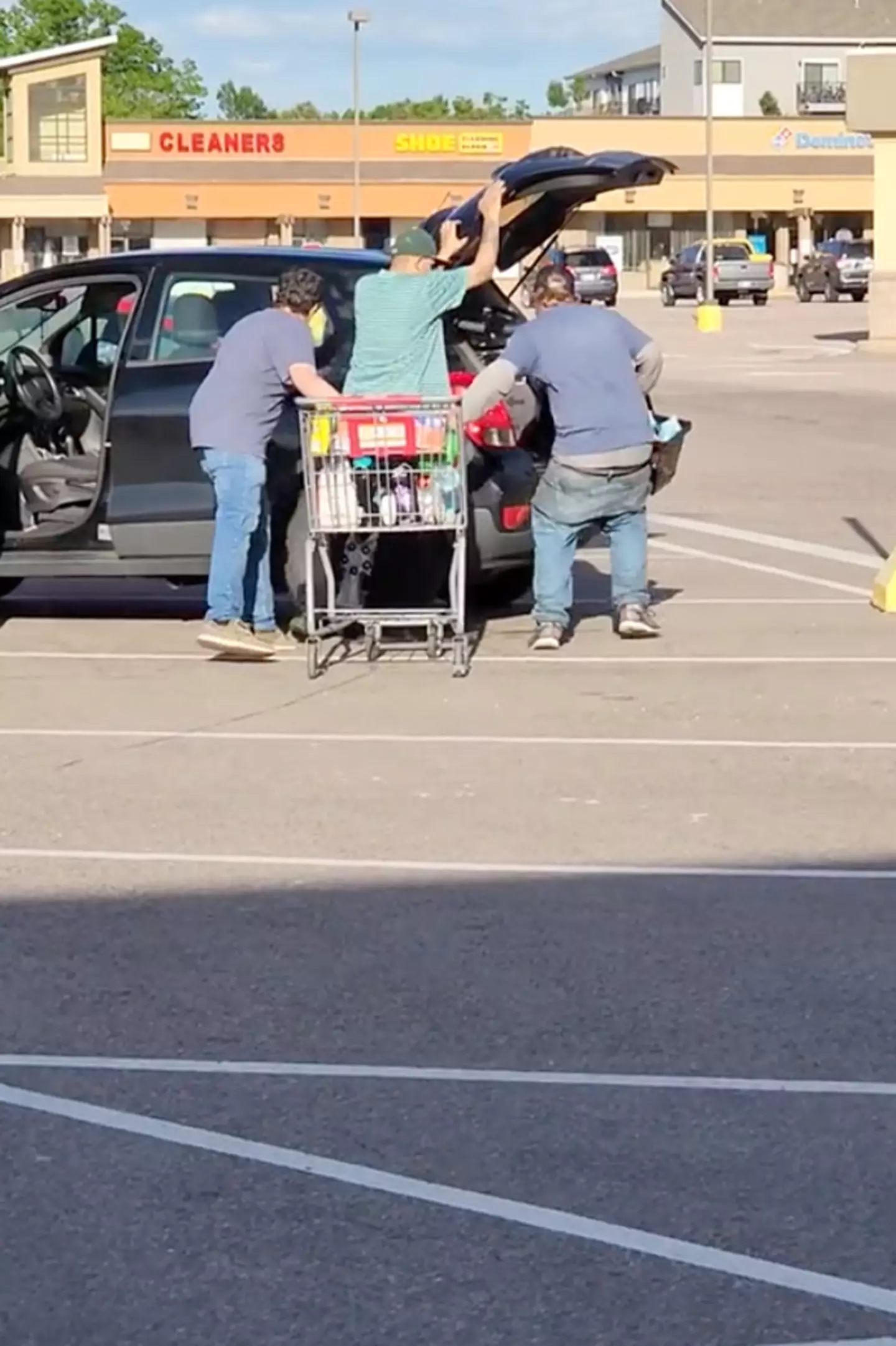 The three men were filmed loading their car with the stolen laundry detergent.
