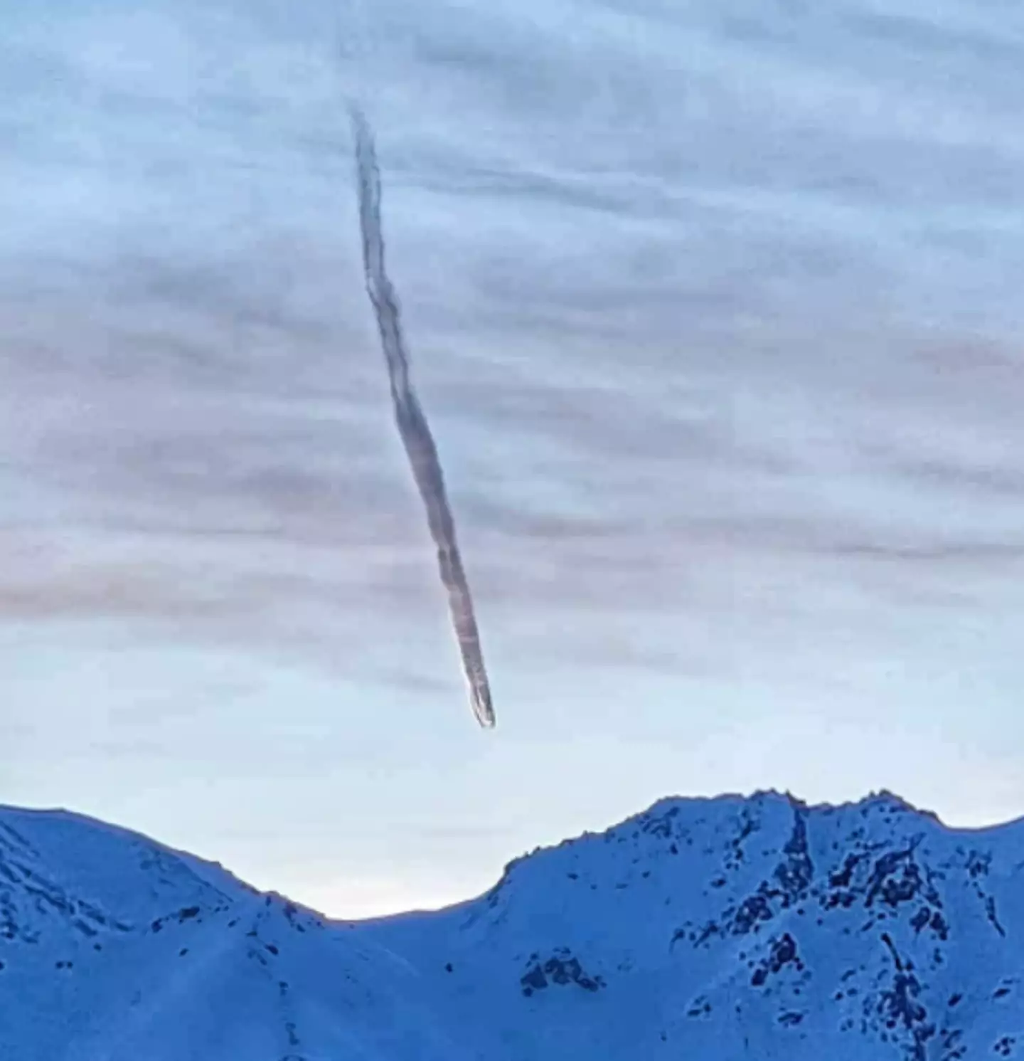 A strange cloud is pictured over Lazy Mountain in Alaska.