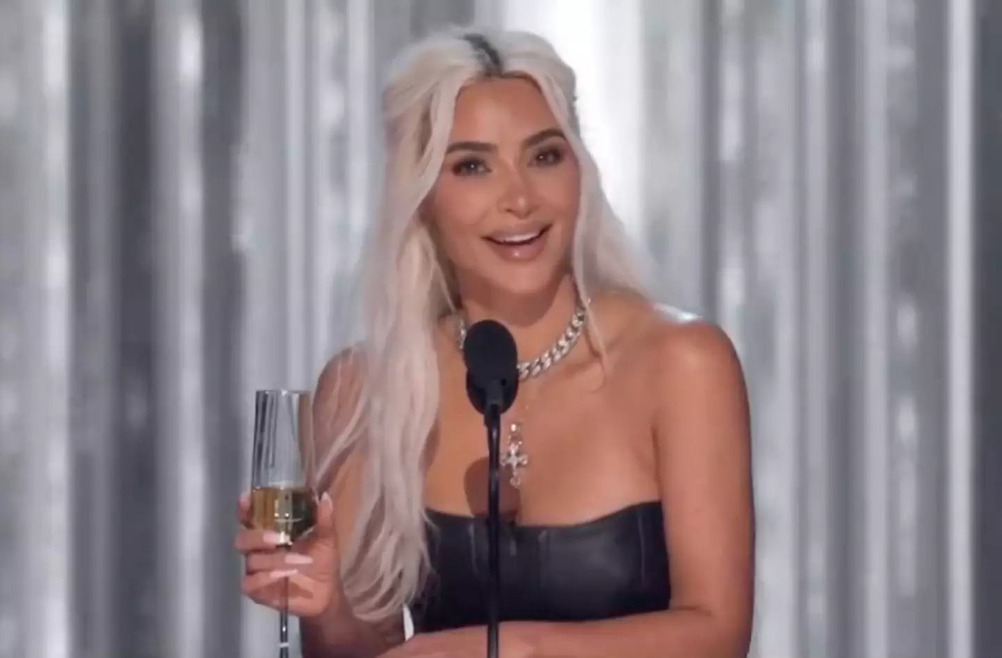 Kim paused in the middle of her joke and looked stunned at the audience after the booing. (Netflix)