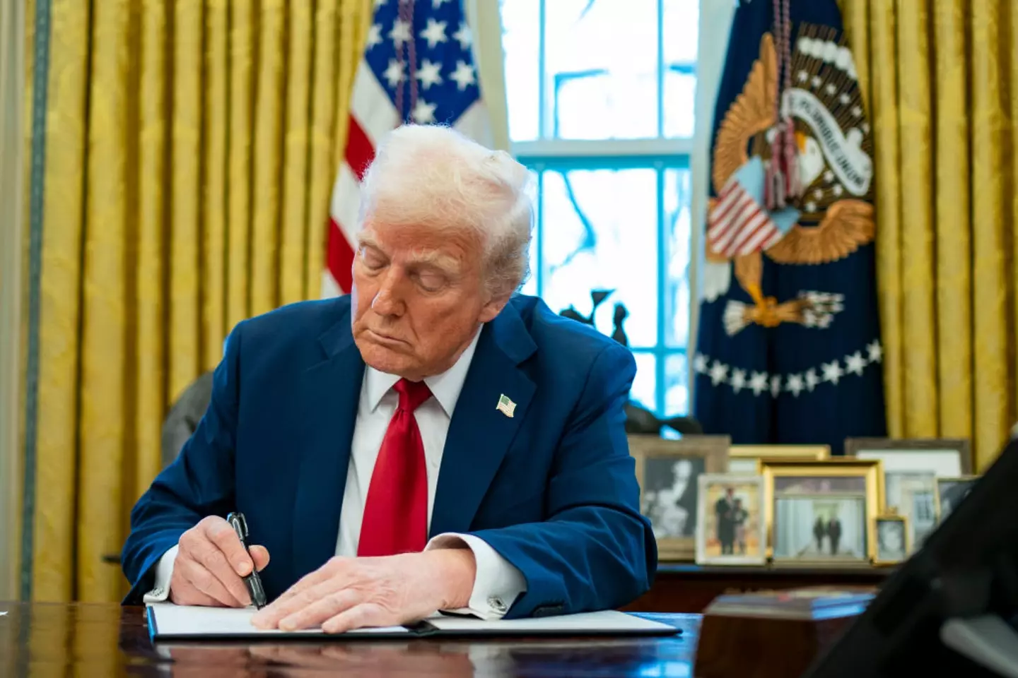 President Donald Trump signed the executive order on his first day back in charge of the US (Bonnie Cash/UPI/Bloomberg via Getty Images)