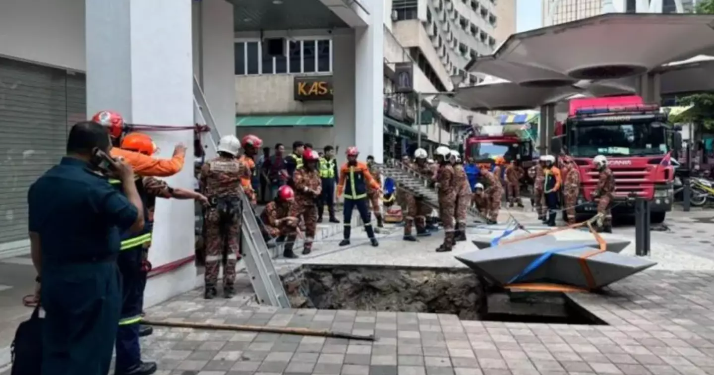 CCTV footage captured the moment the woman fell into the ground. (Kuala Lumpur Fire and Rescue Department)