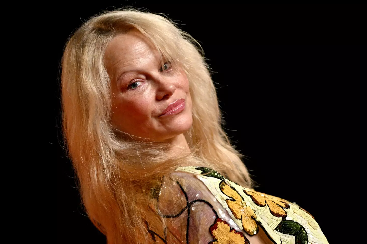 Pamela Anderson went bare-faced at the star-studded Oscars party.