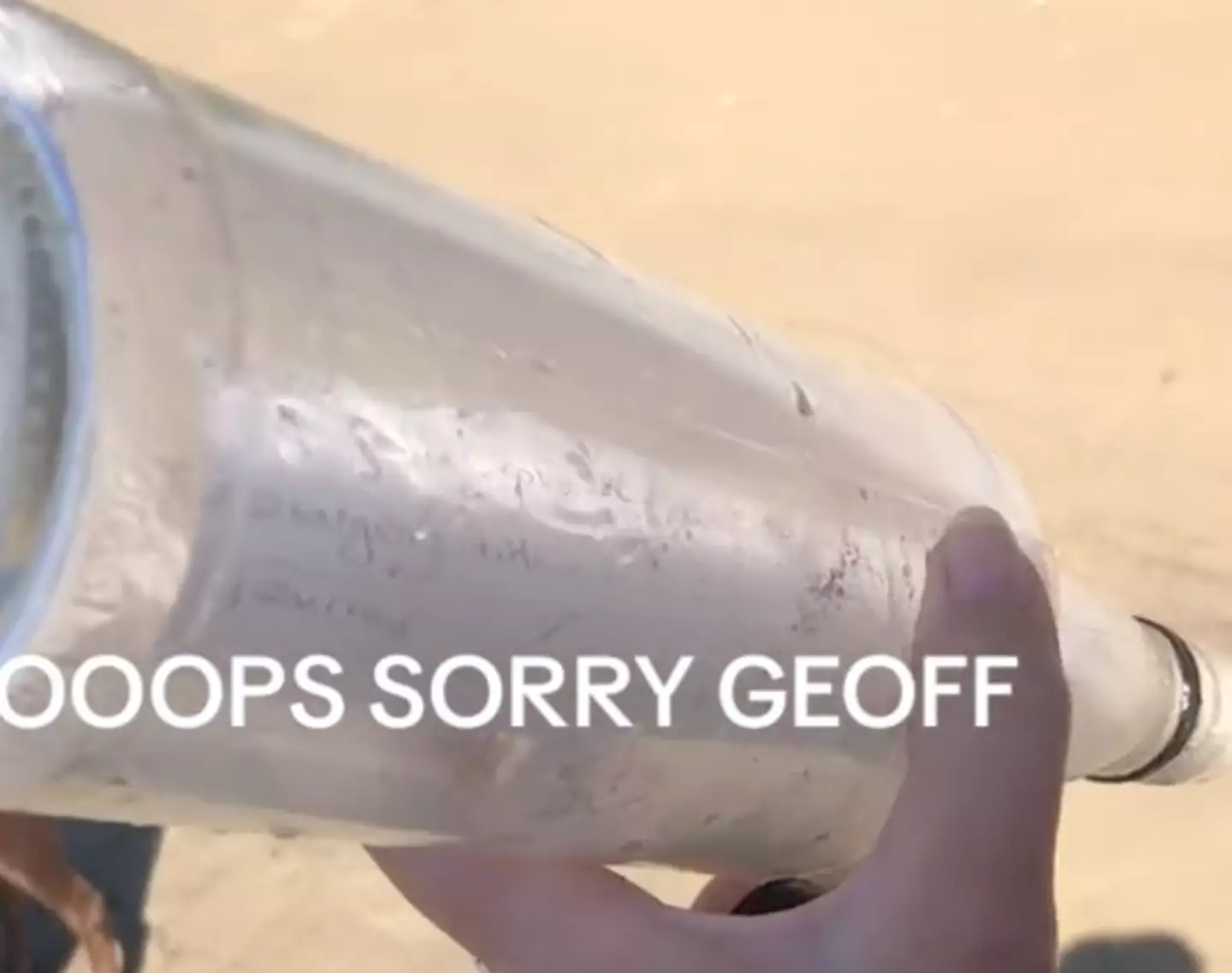 The couple accidentally emptied the bottle on the beach.