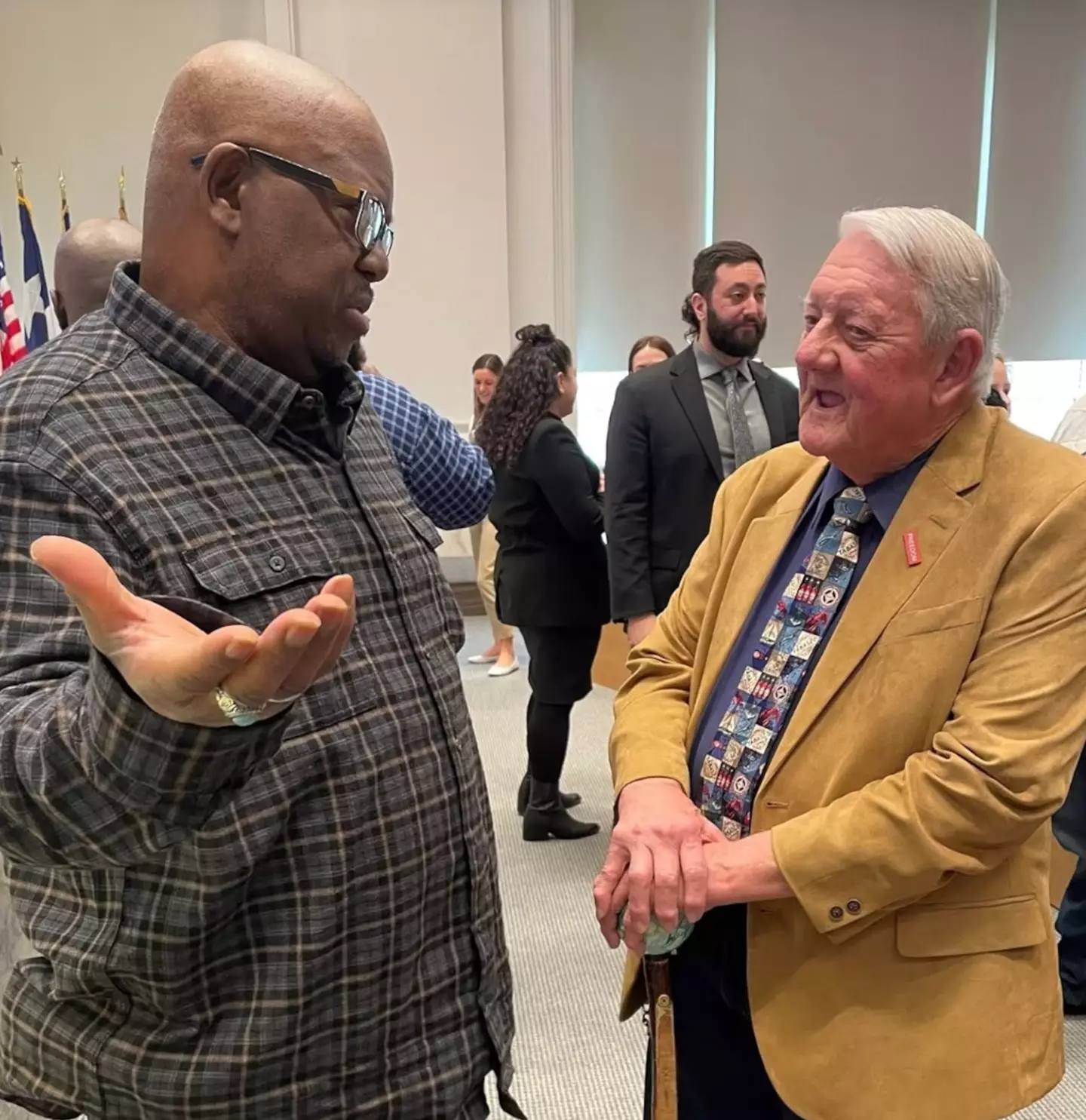 Ted Smith seen speaking to Venice Parker's son, Joseph Parker (Dallas County DA)