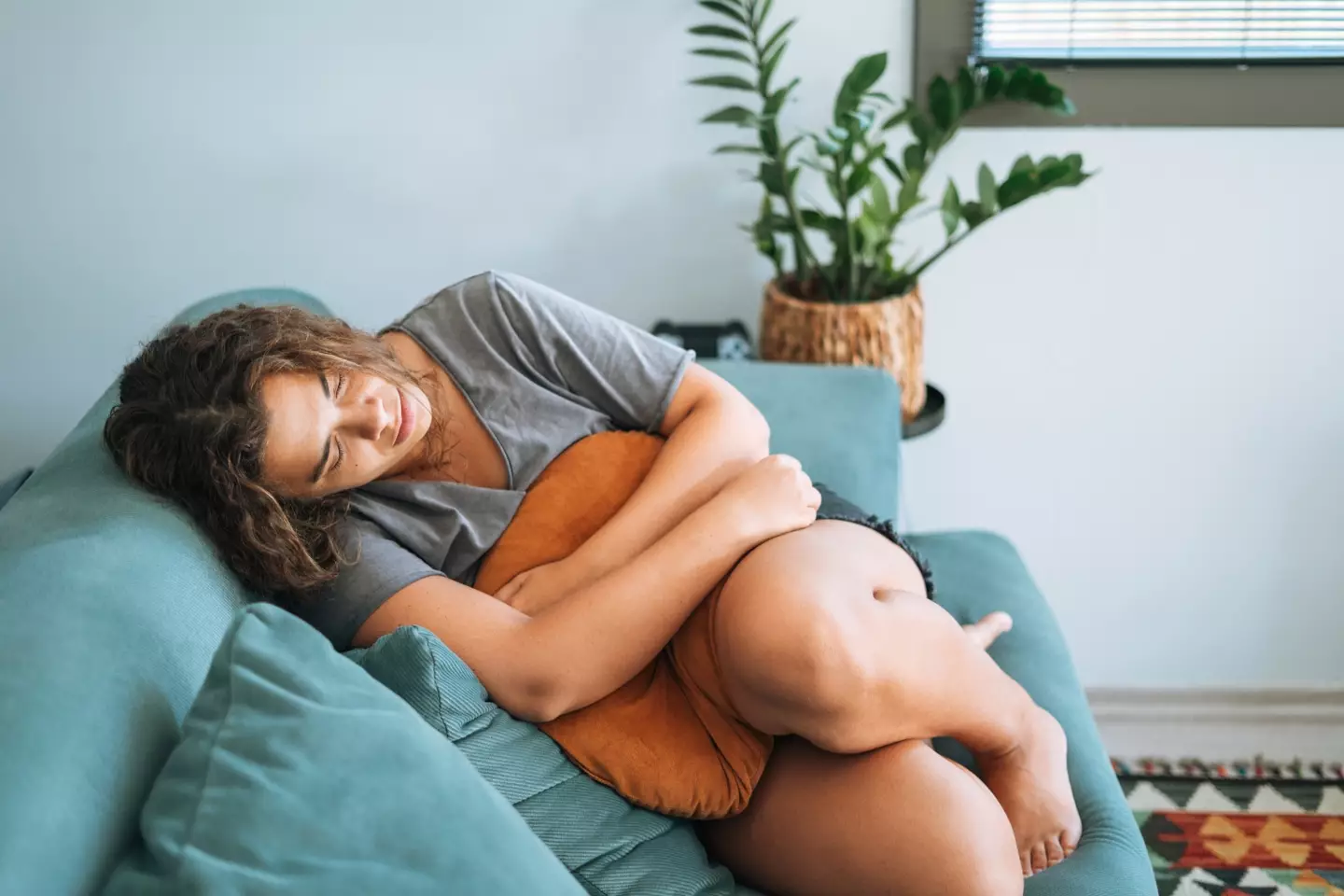 The TikToker said her stomach pains left her curled over in the fetal position (Getty Stock Image)