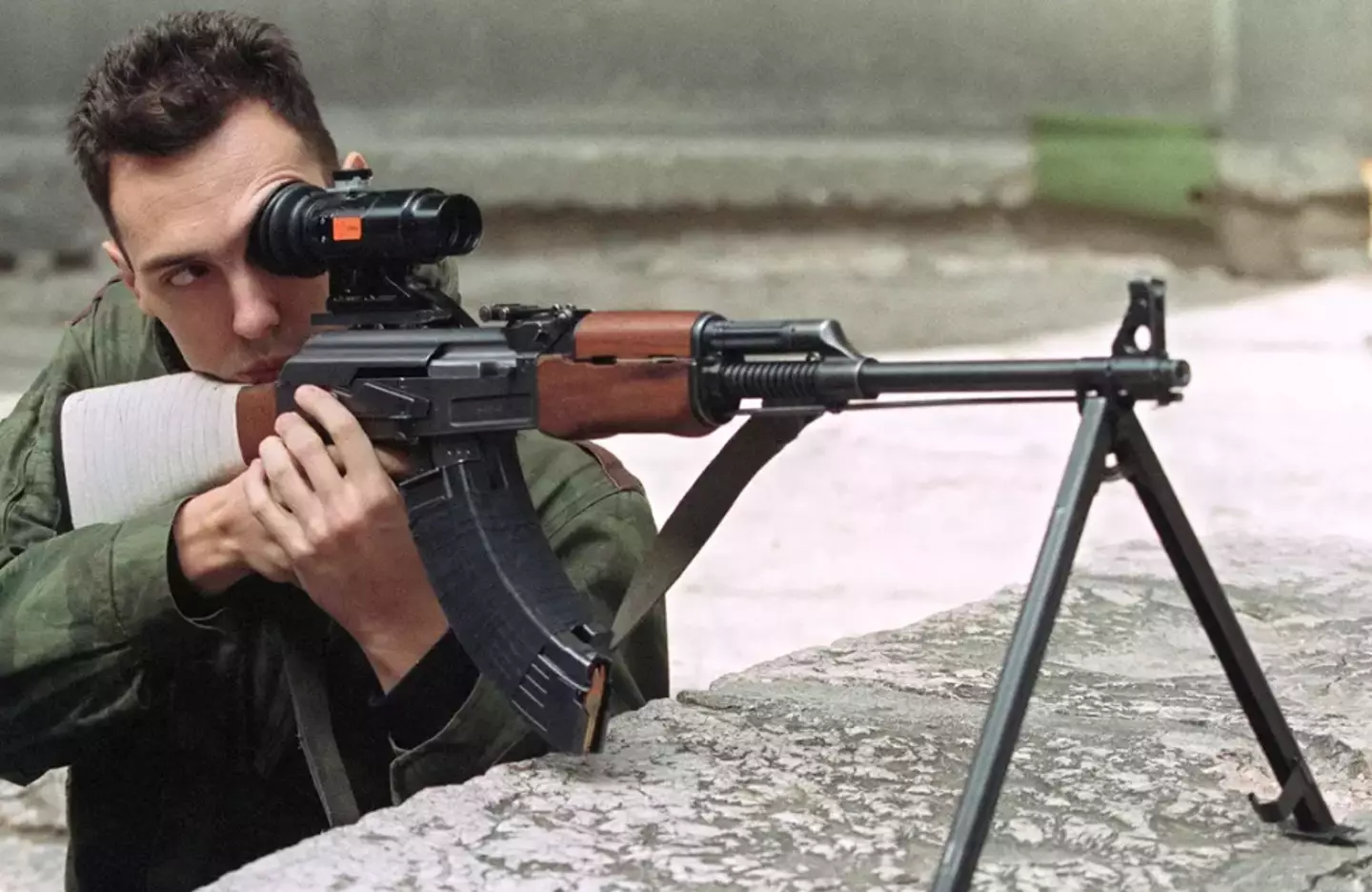 A sniper taking aim in Sarajevo (MICHAEL EVSTAFIEV/AFP via Getty Images)