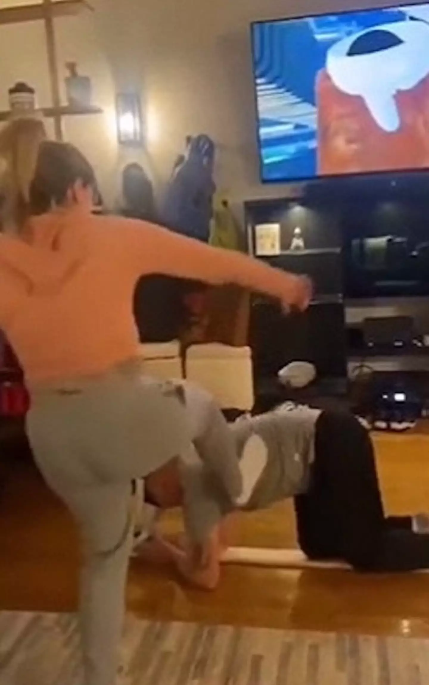 His partner can be seen kicking him off the virtual plank.