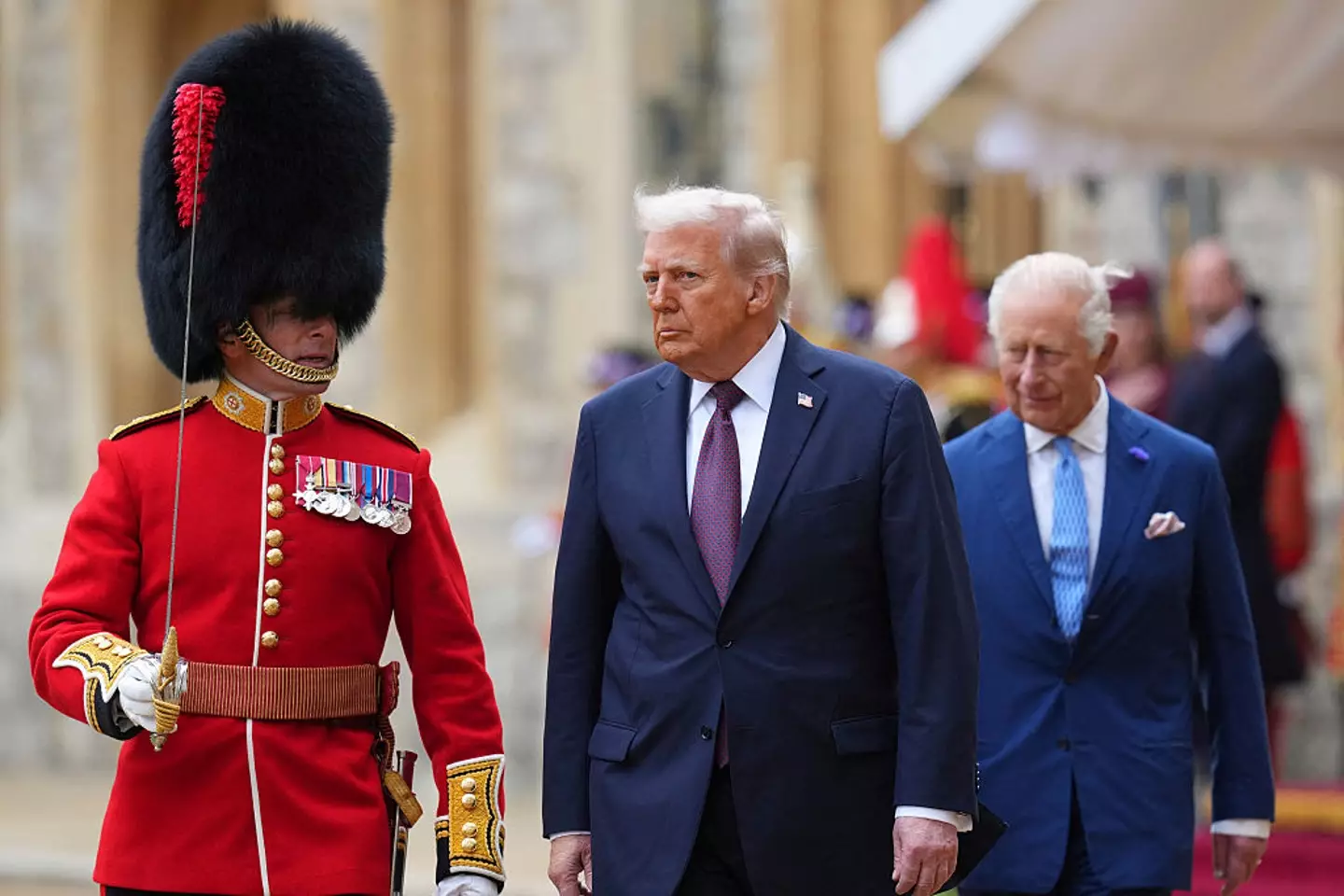 Trump was seen marching ahead of the King (KIRSTY WIGGLESWORTH/POOL/AFP via Getty Images)