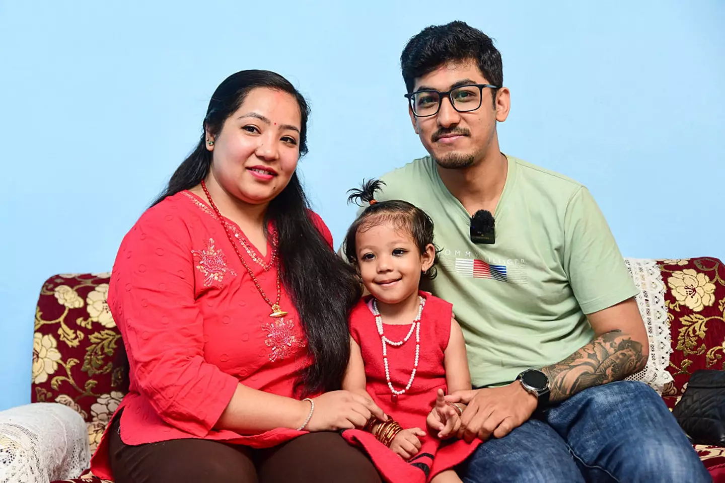 Aryatara Shakya seen at her home with her father and mother ahead of being formally worshipped at the historic Kumari Ghar in Kathmandu, Nepal (Safal Prakash Shrestha/NurPhoto via Getty Images)