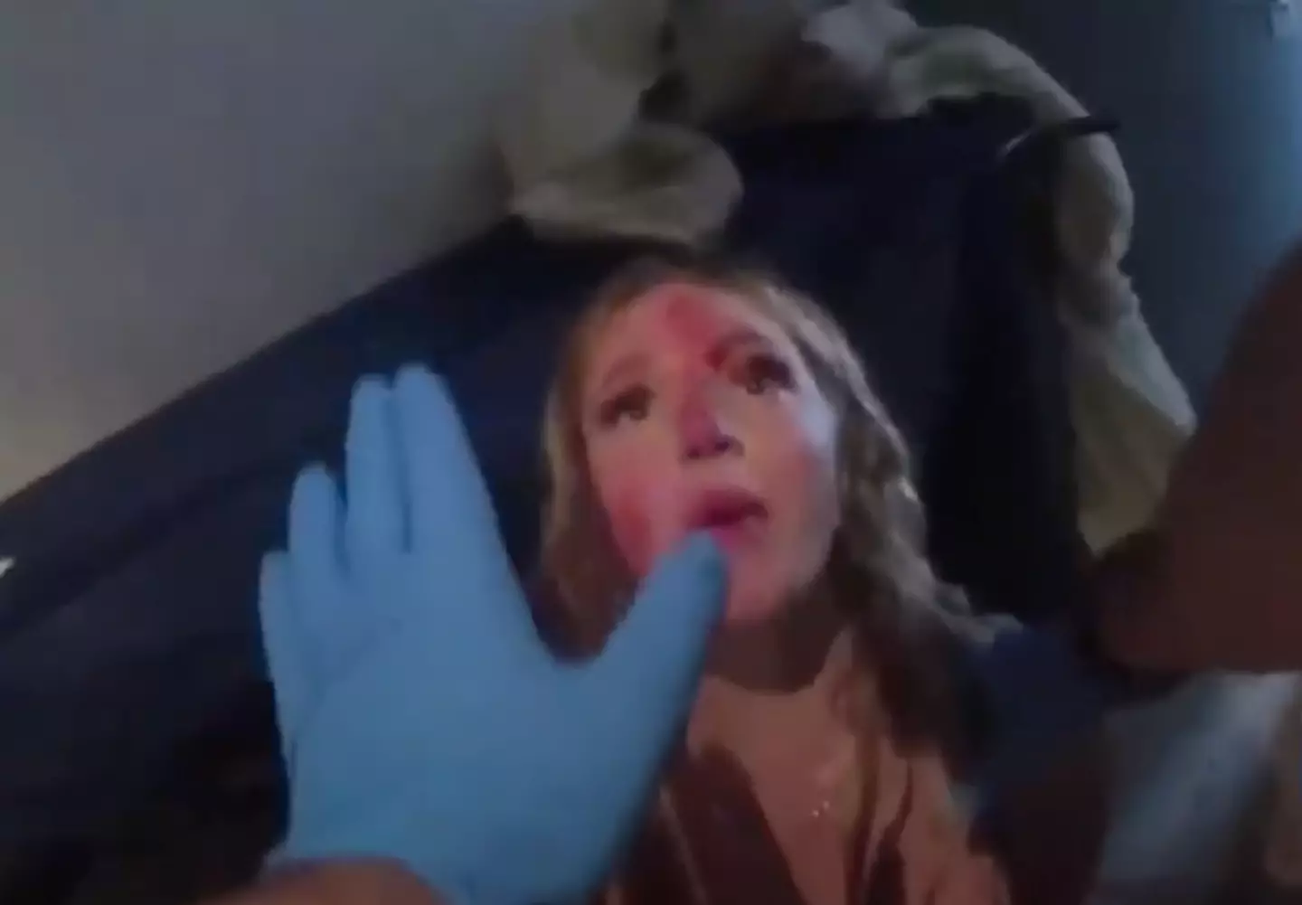 Courtney Clenney was covered in blood as she pleaded with police to let her see her boyfriend.