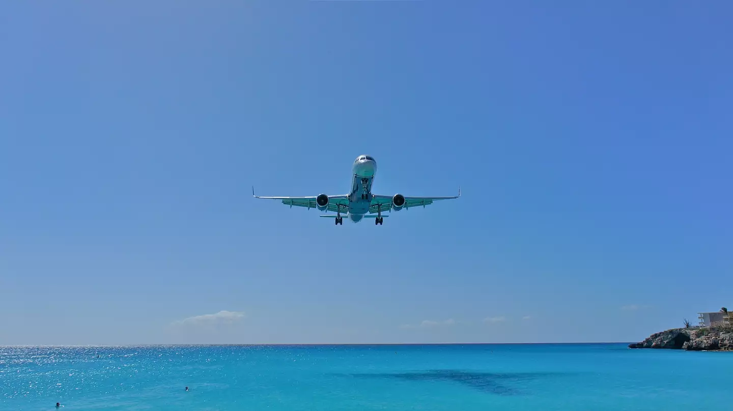 The airport has a runway that is insane close to the beach.