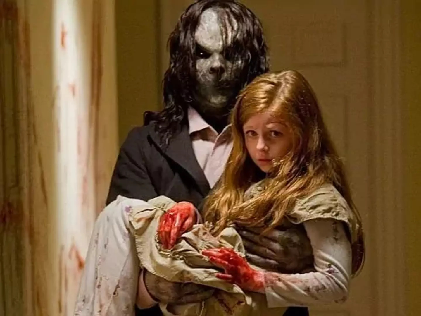 The two creepiest things in all of horror. People in masks and weird kids. (Lionsgate)