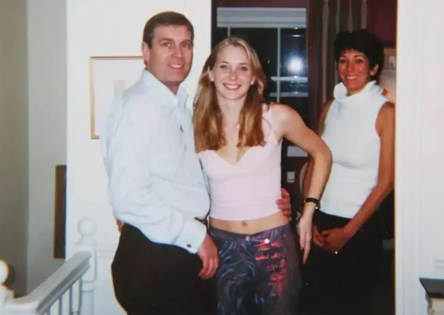 A notorious shows Prince Andrew and Virginia Giuffre, with Ghislaine Maxwell in the background.