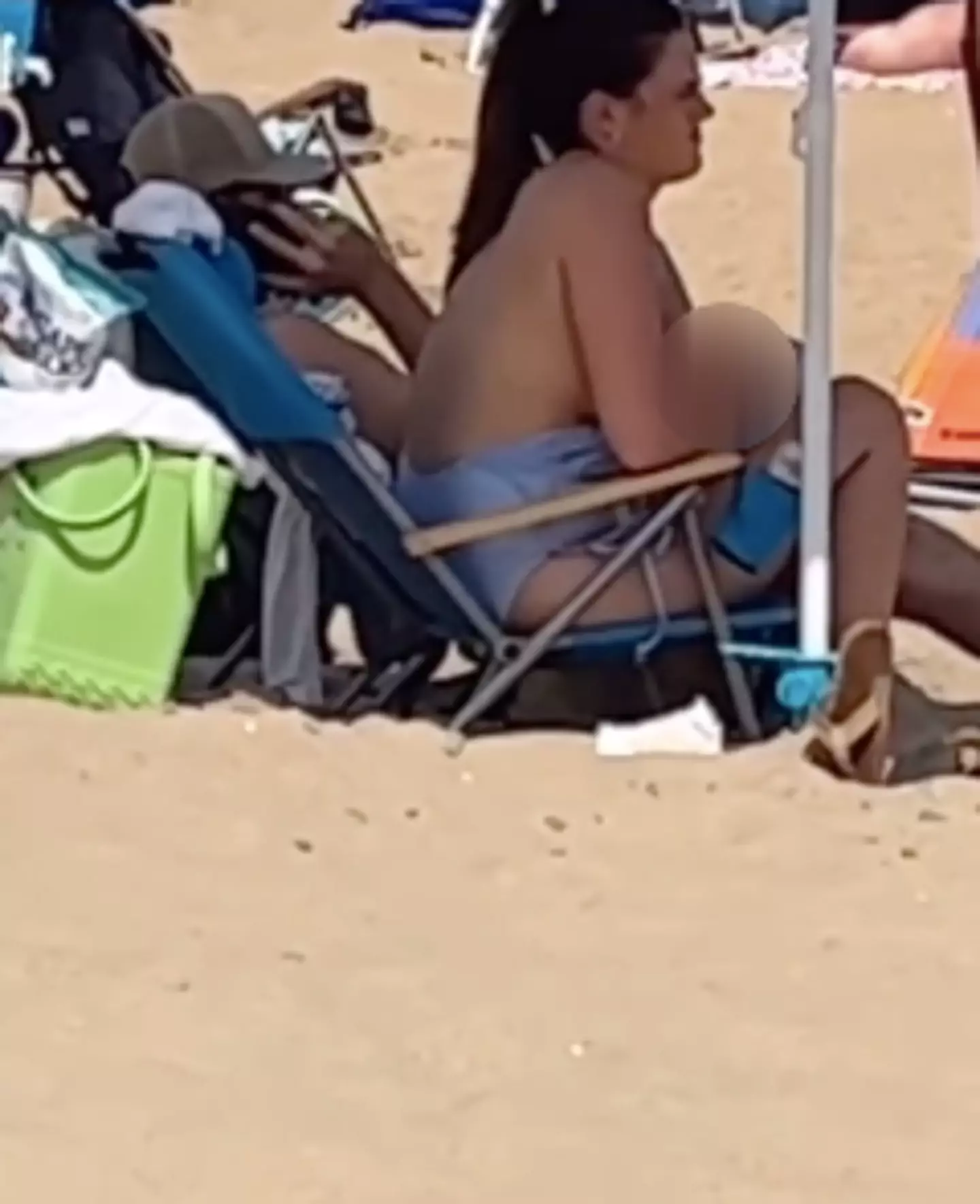 Izabele Lomax was secretly filmed breastfeeding her baby at the beach.