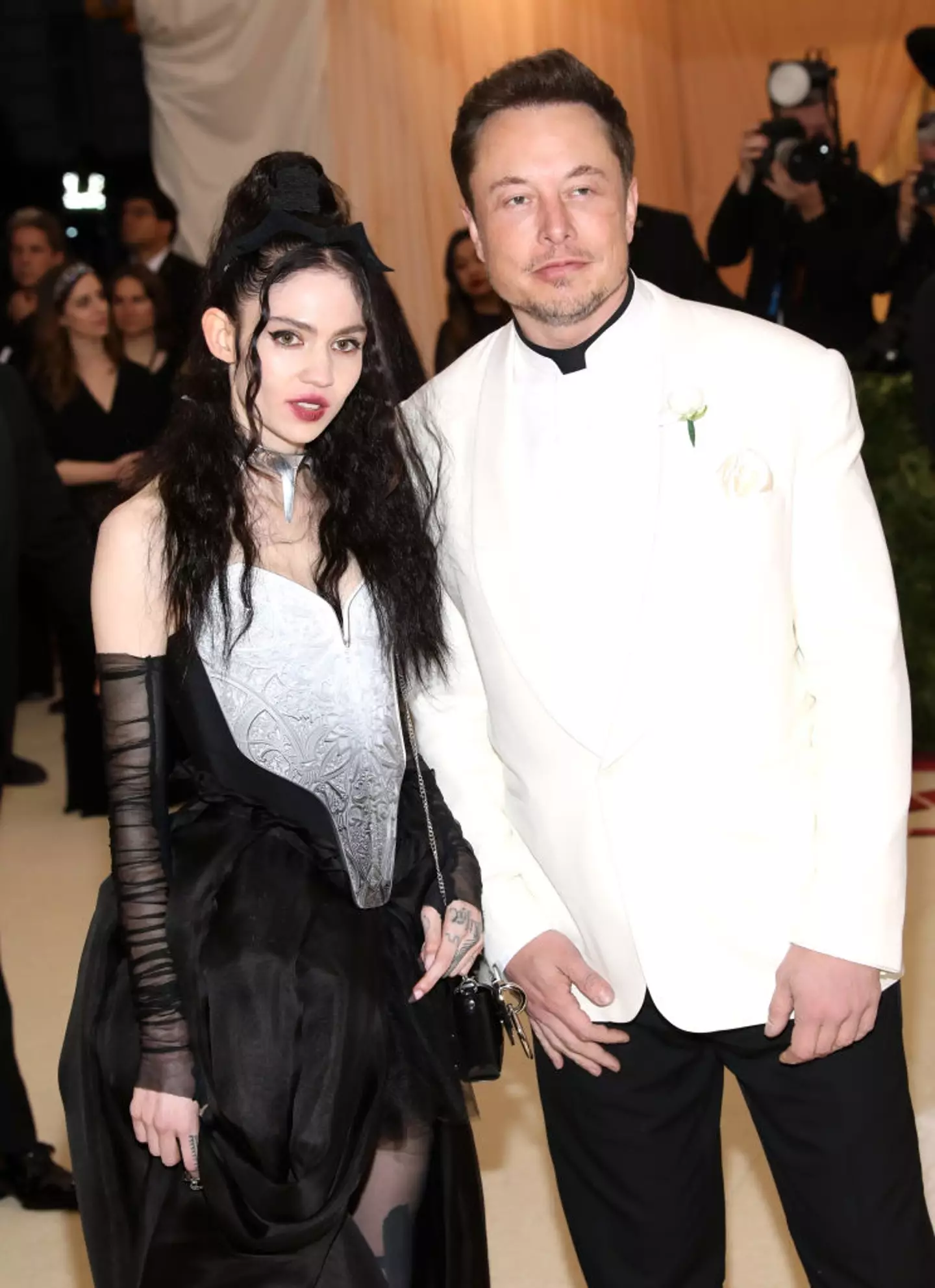 Grimes and Elon Musk pictured together in 2018 (Amy Sussman/WWD/Penske Media via Getty Images)