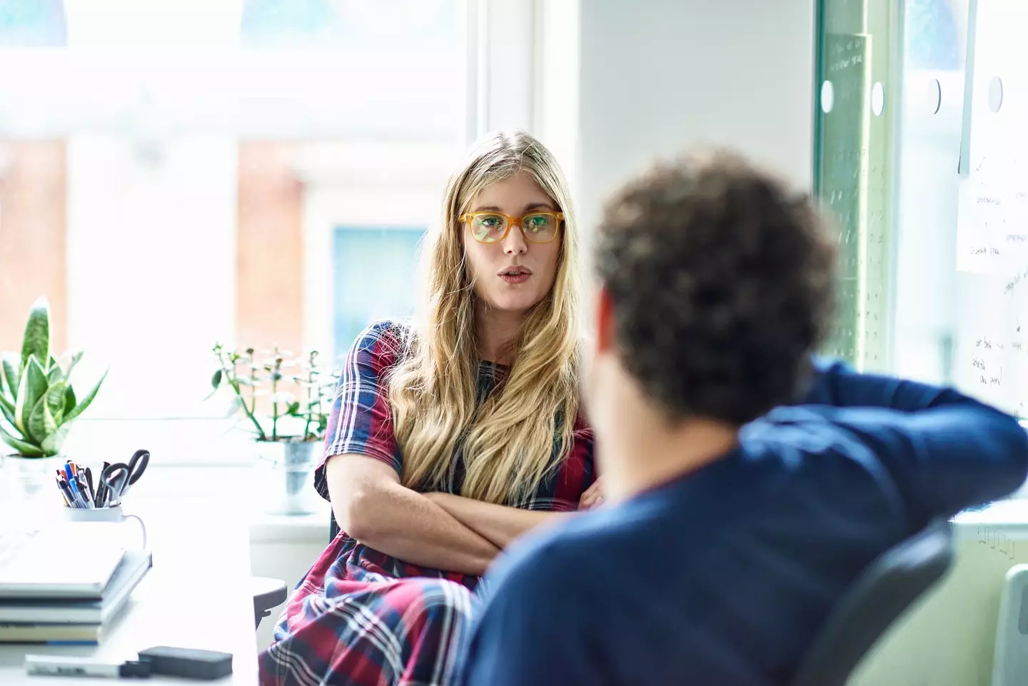The body language experts said that crossing your arms isn't a 'blocking behavior' (Getty Stock)