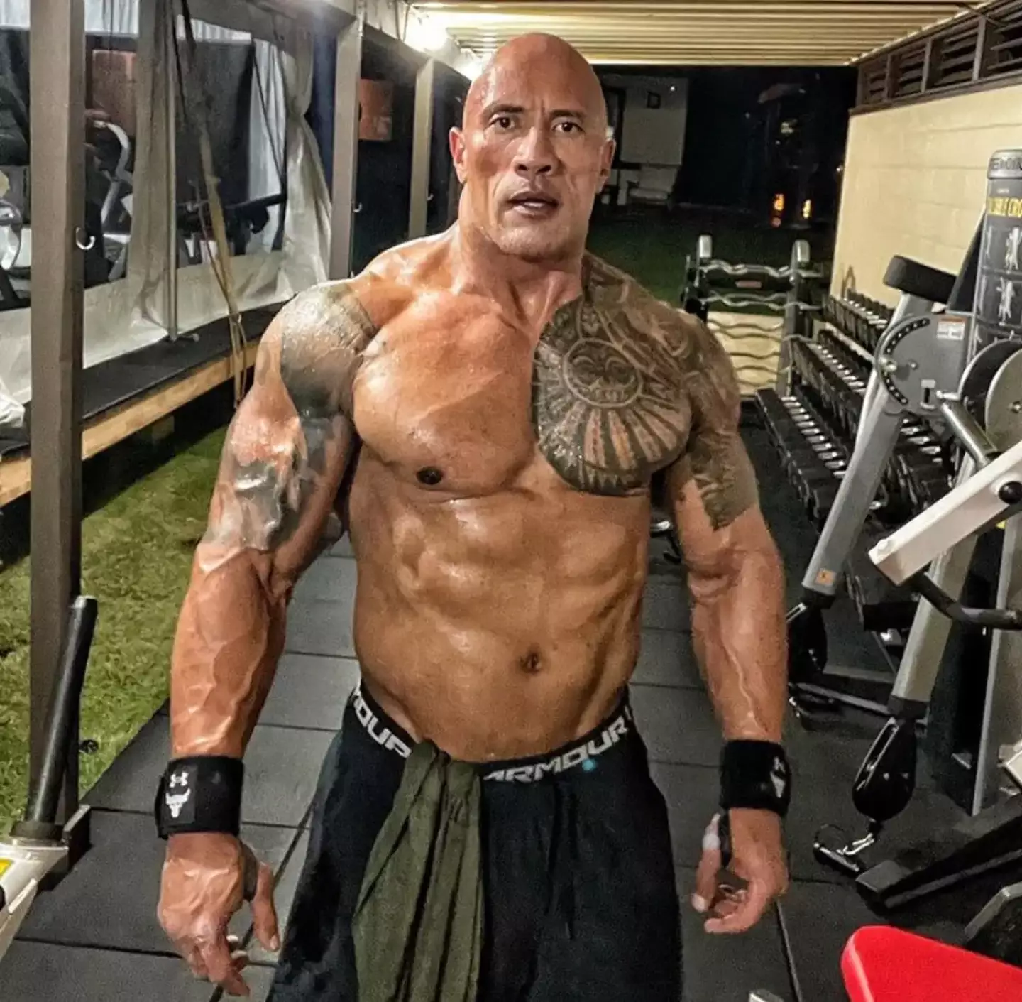 The internet is wondering why The Rock doesn't have a six pack.