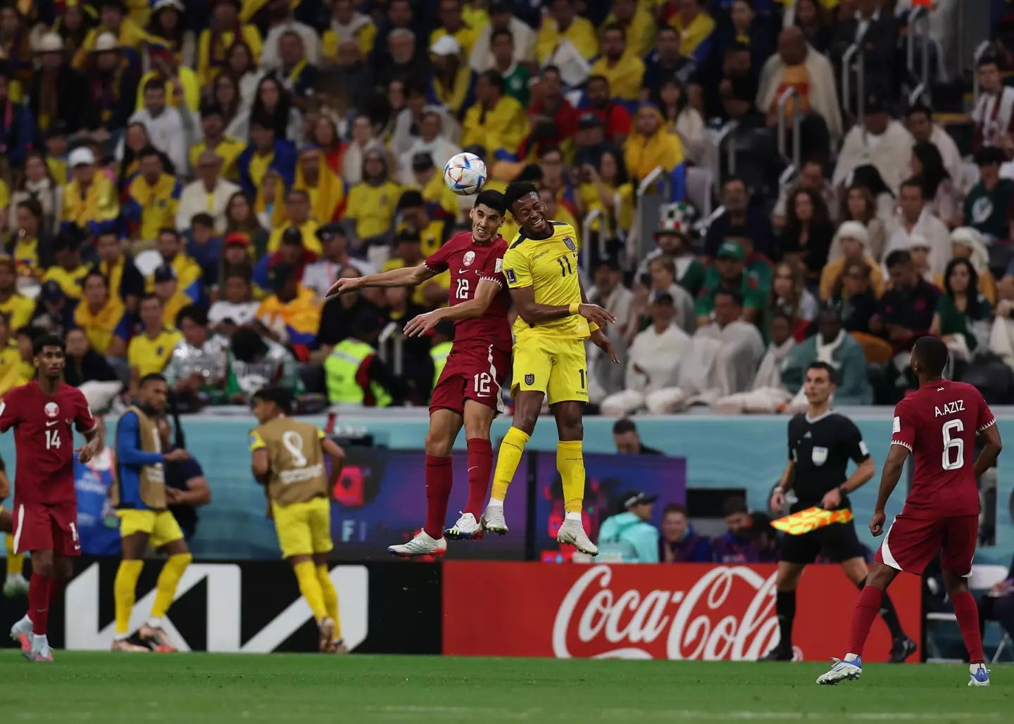 Karim Boudiaf of Qatar heads the ball over Enner Valencia of Ecuador at Al Bayt Stadium during game one of the 2022 FIFA World Cup.