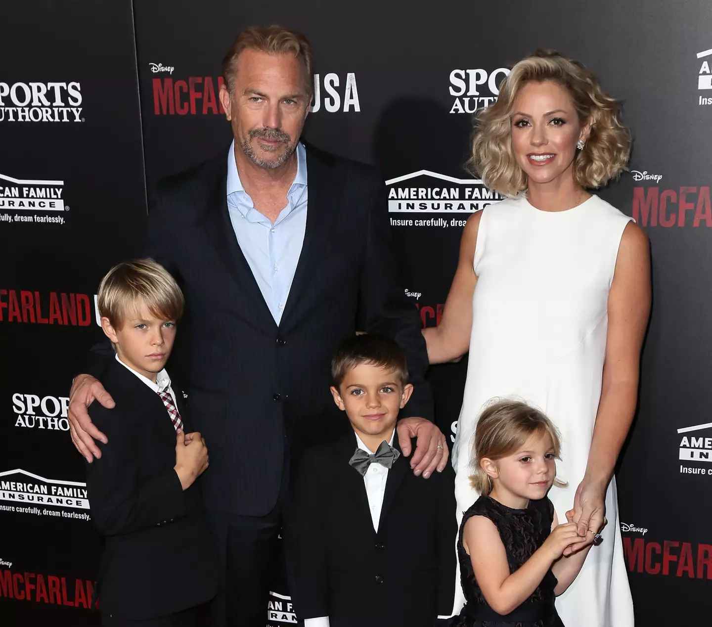 Costner and Baumgartner with their kids in 2015.
